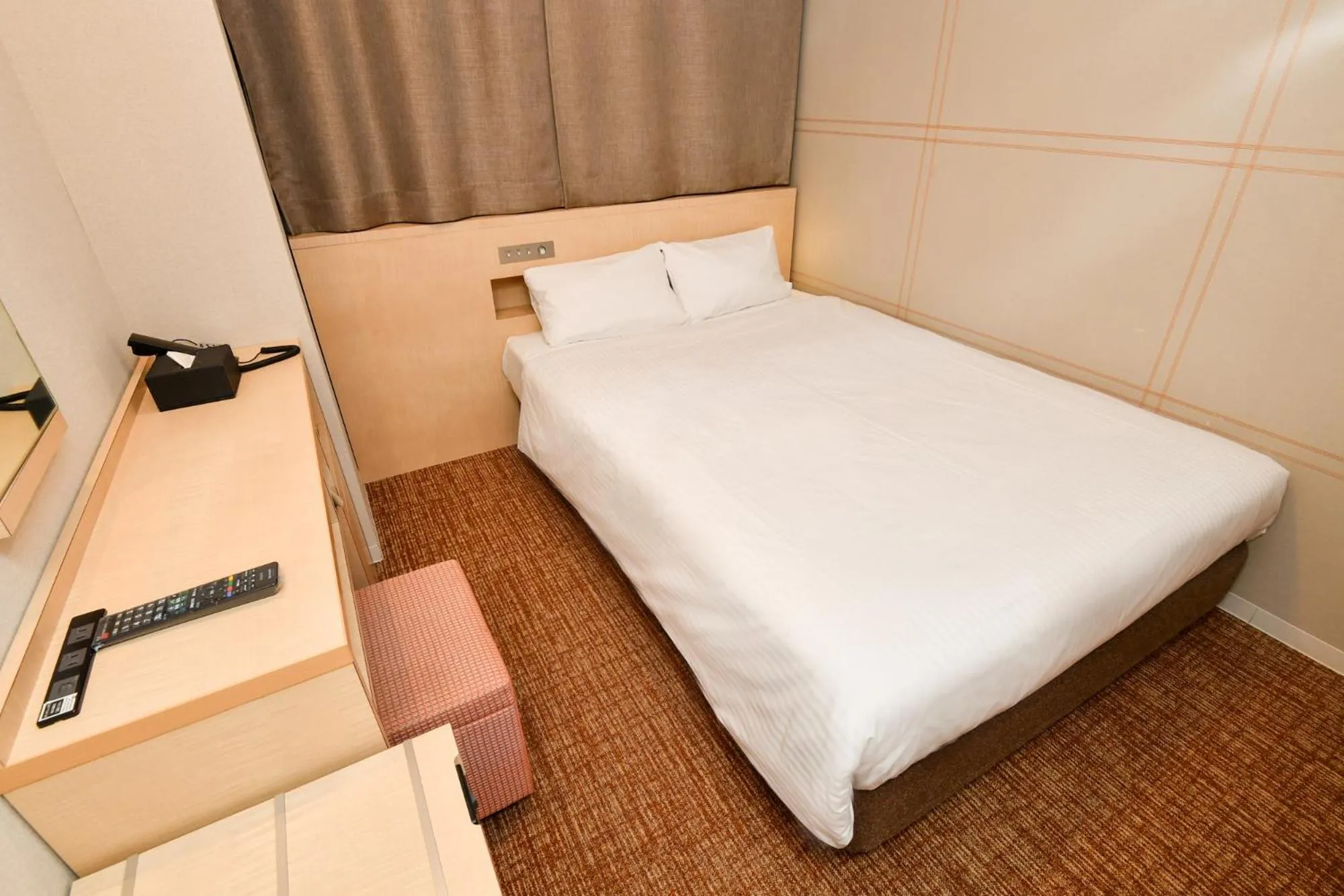 Bed in Sanco Inn Nagoya Shinkansen-guchi Annex