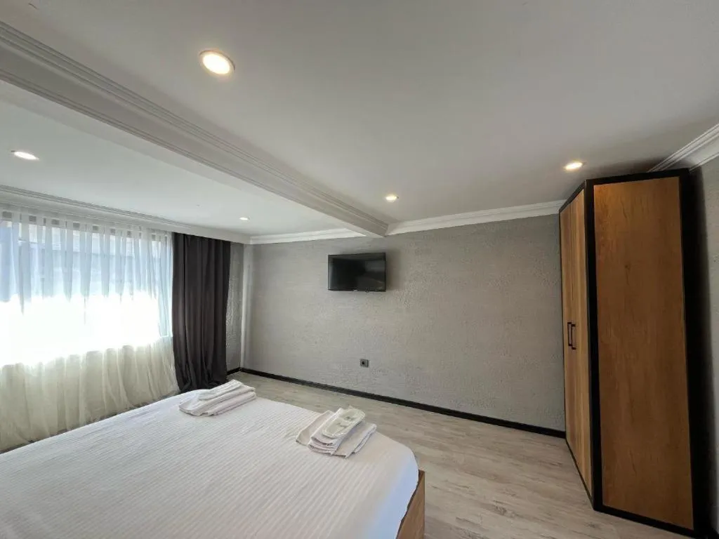 Bed in Le Safran Suite Hotel