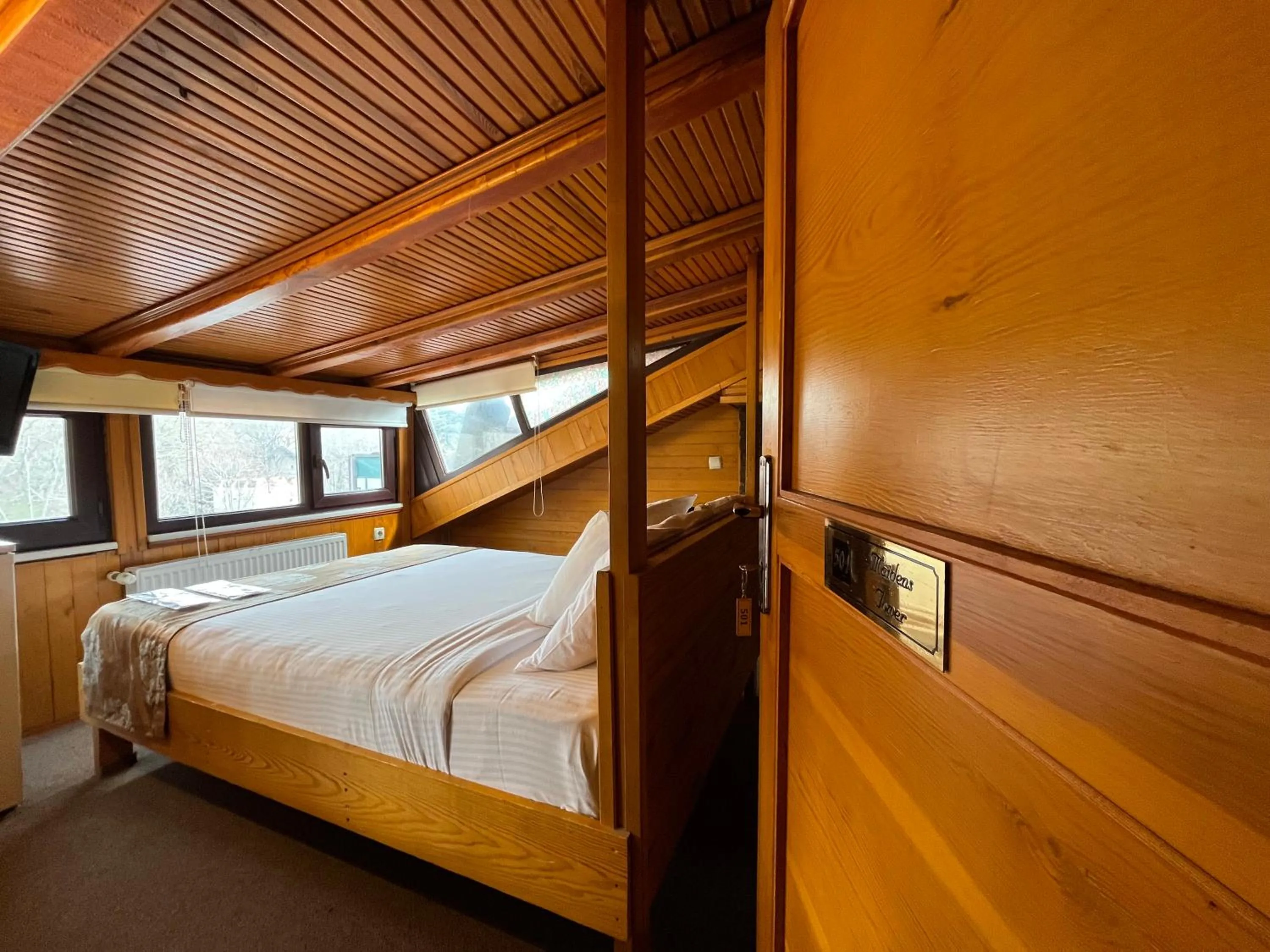 Bed in Le Safran Suite Hotel