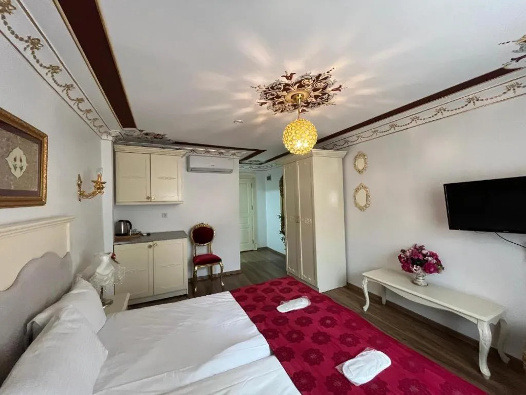 Bed in Le Safran Suite Hotel