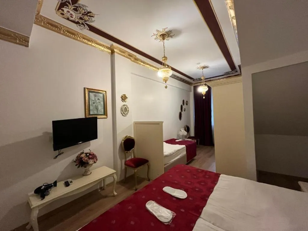 Bed in Le Safran Suite Hotel