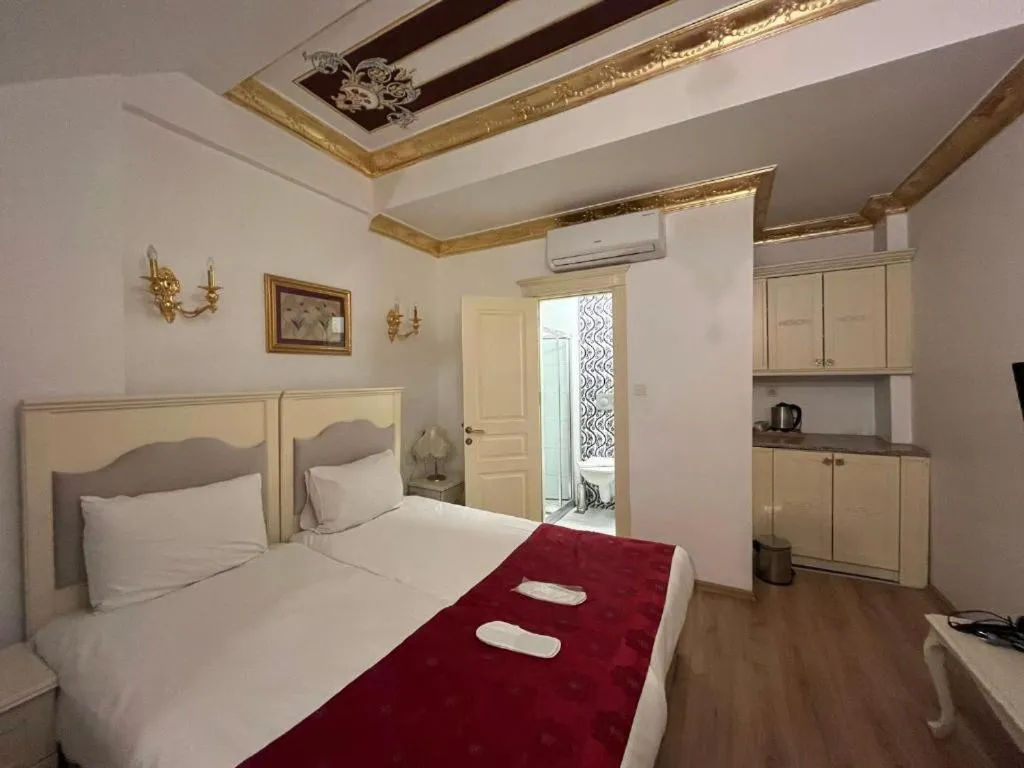 Bed in Le Safran Suite Hotel