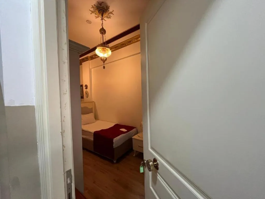 Bed in Le Safran Suite Hotel