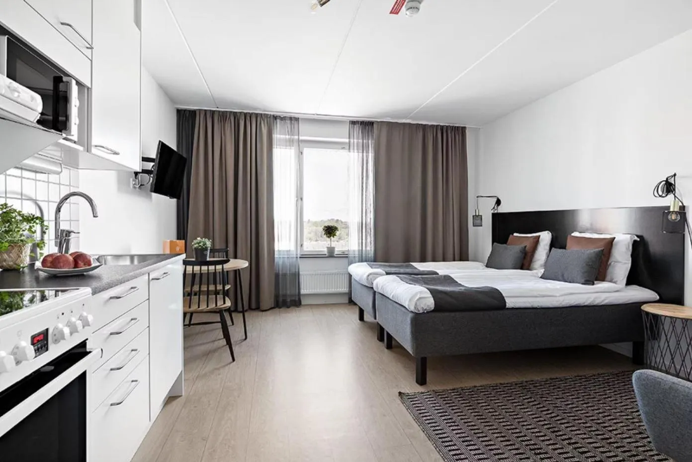 Kitchen or kitchenette, Bed in Forenom Hotel Flemingsberg - 10min from Älvsjö