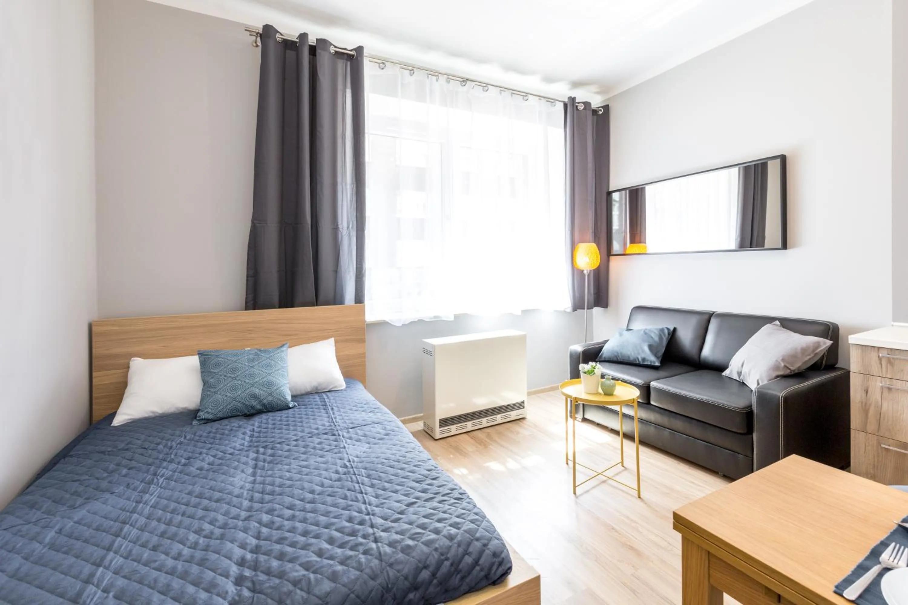 Living room, Bed in Friendhouse Apartments Avenue