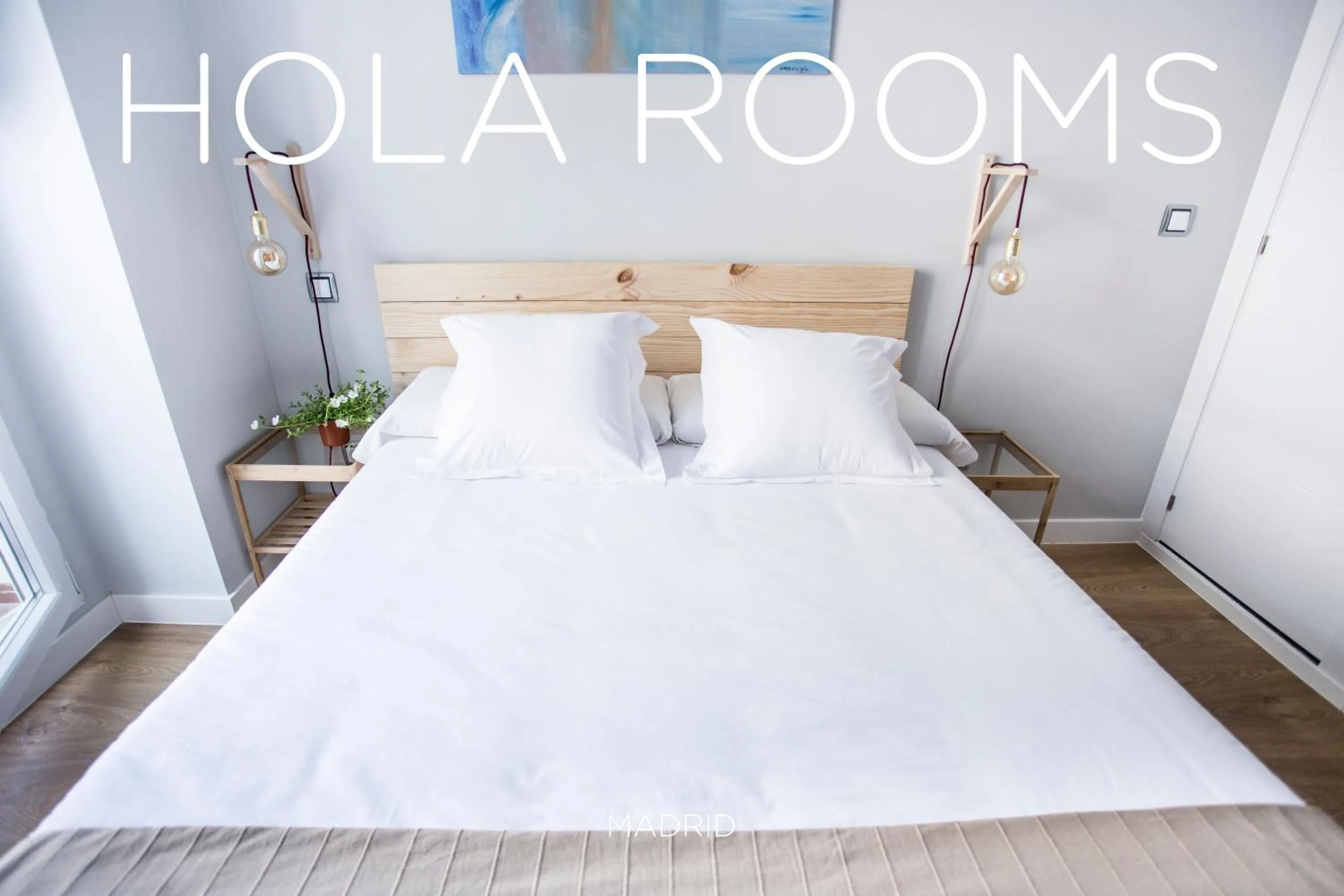 Bed in Hola Rooms