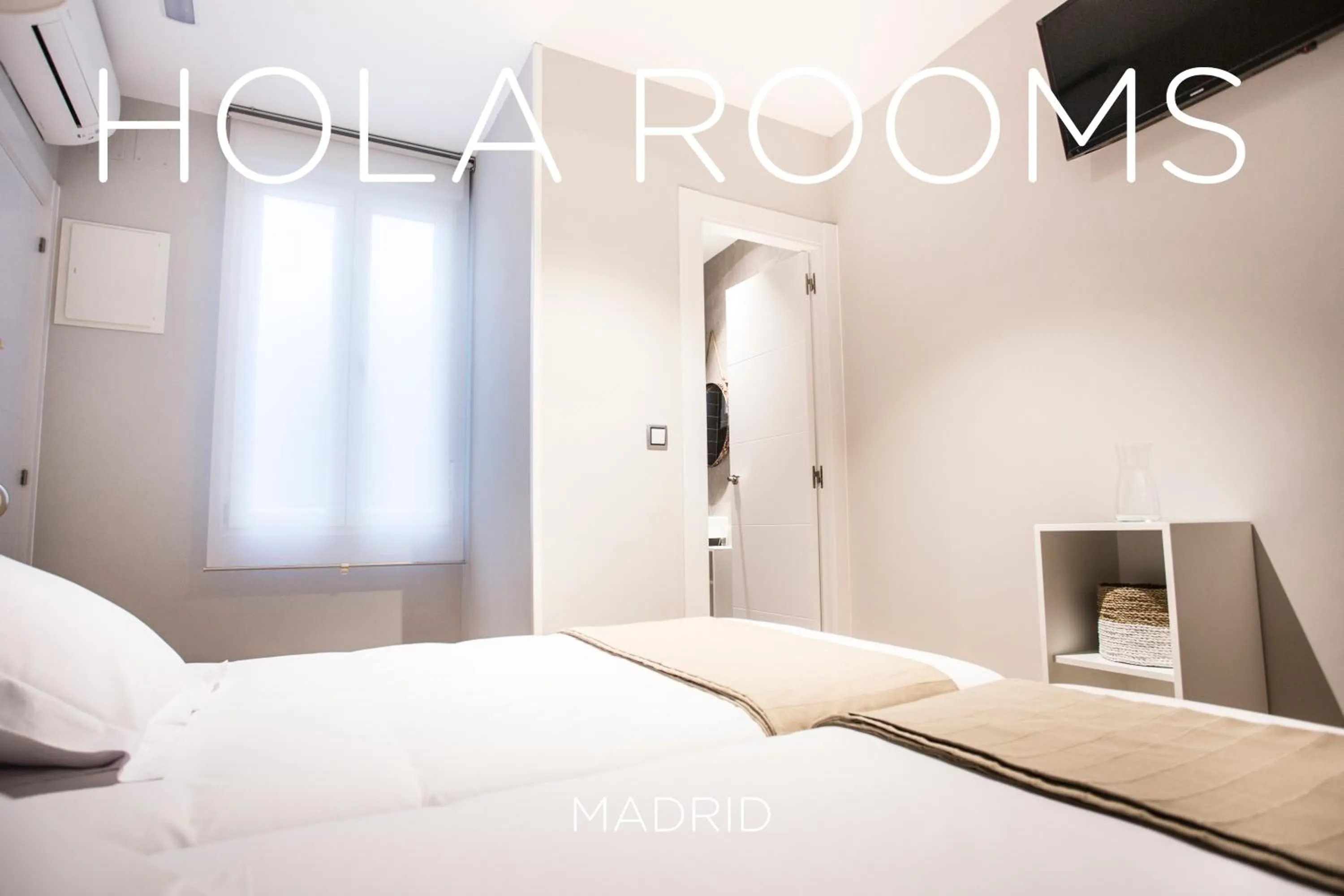Bed in Hola Rooms