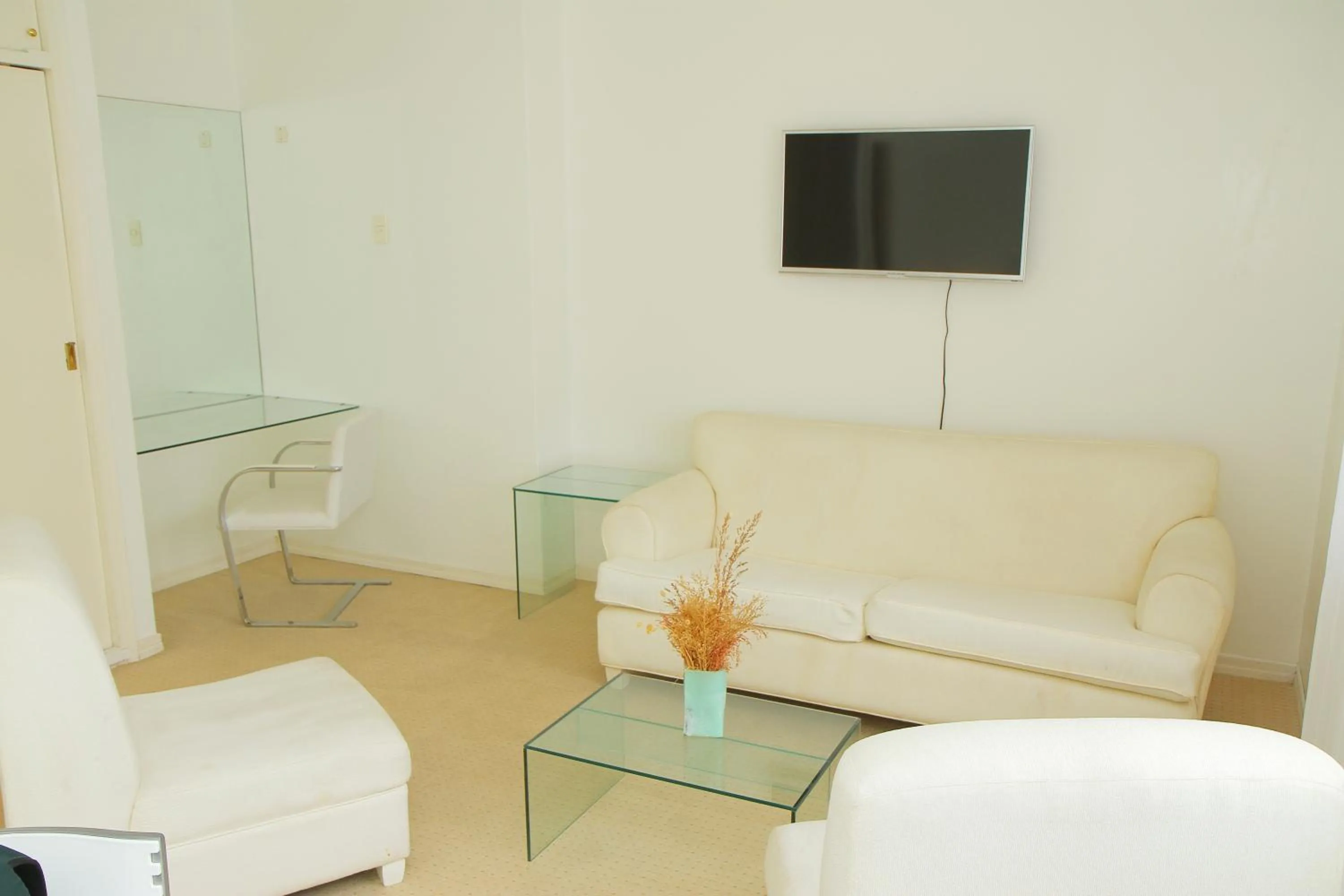 Communal lounge/ TV room in Aqua Hotel