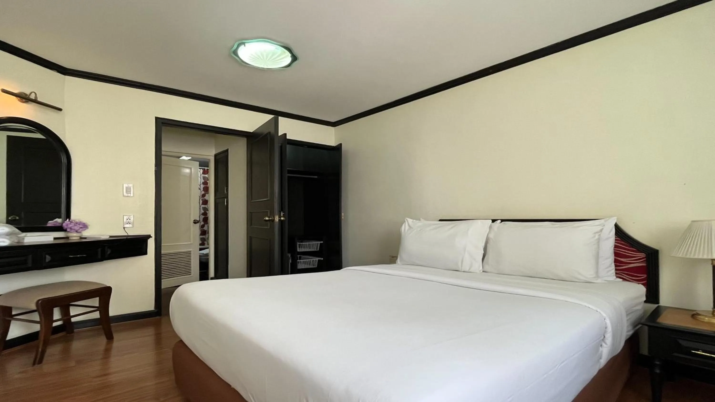 Bed in Yellow Ribbon Hills Boutique Suites