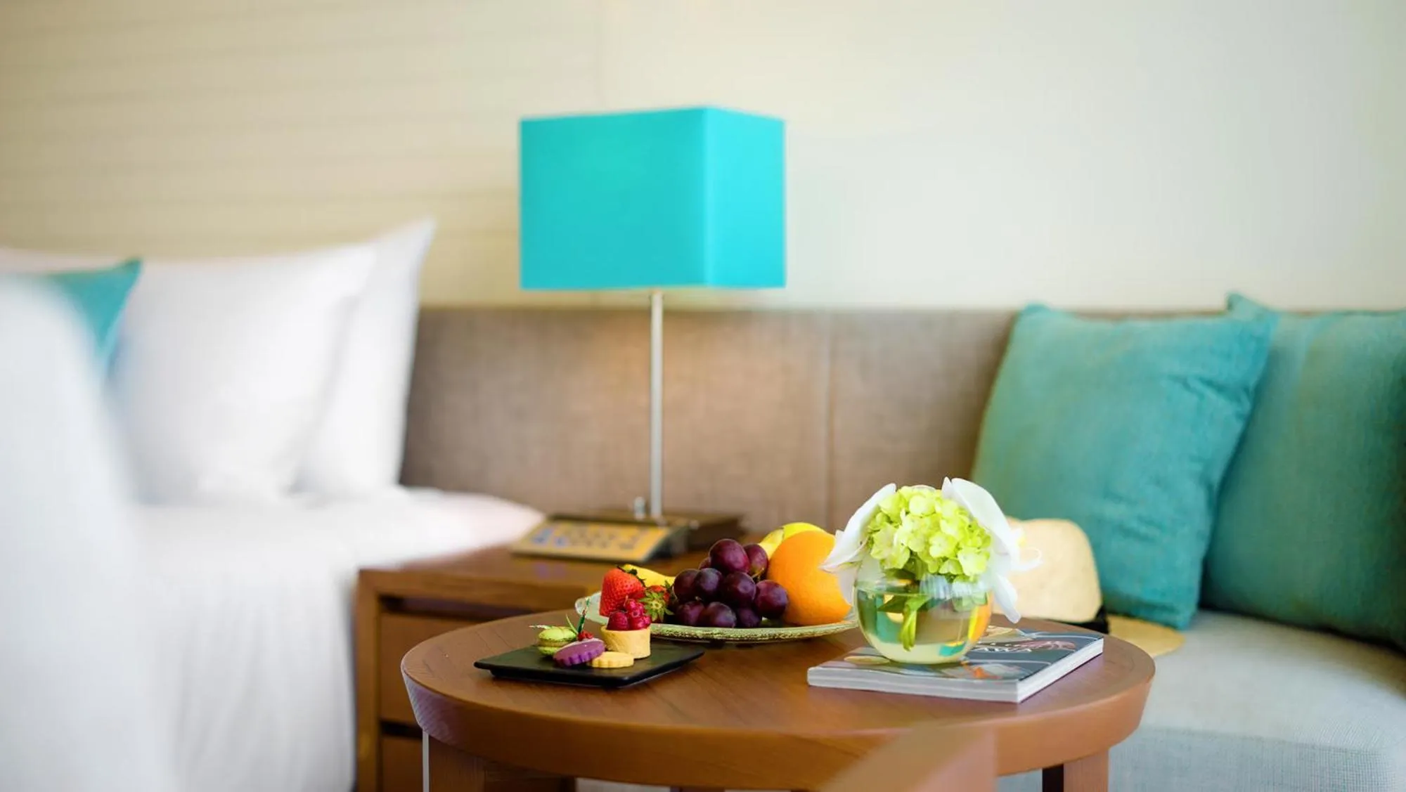 Bed in ANA InterContinental Manza Beach Resort by IHG