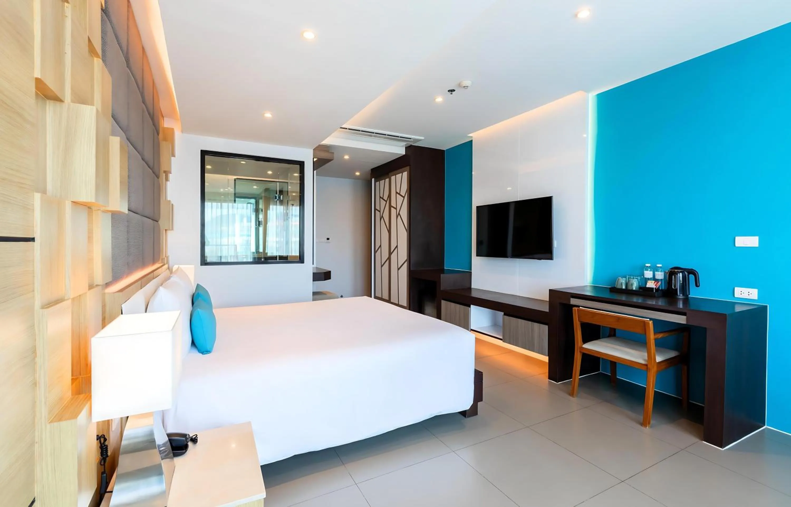 Photo of the whole room, Bed in The Marina Phuket Hotel