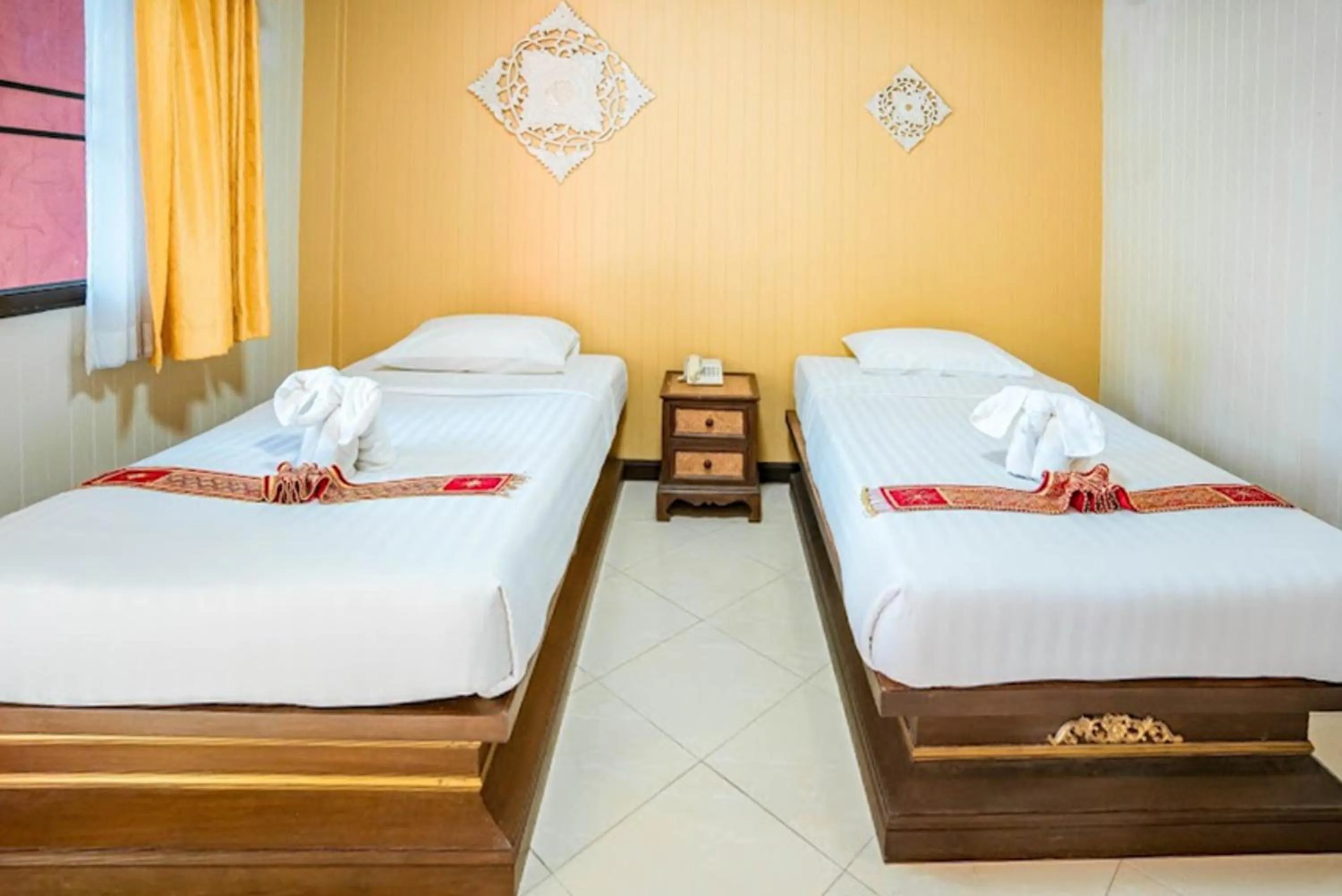 Bed in Kasalong Resort and Spa Pattaya
