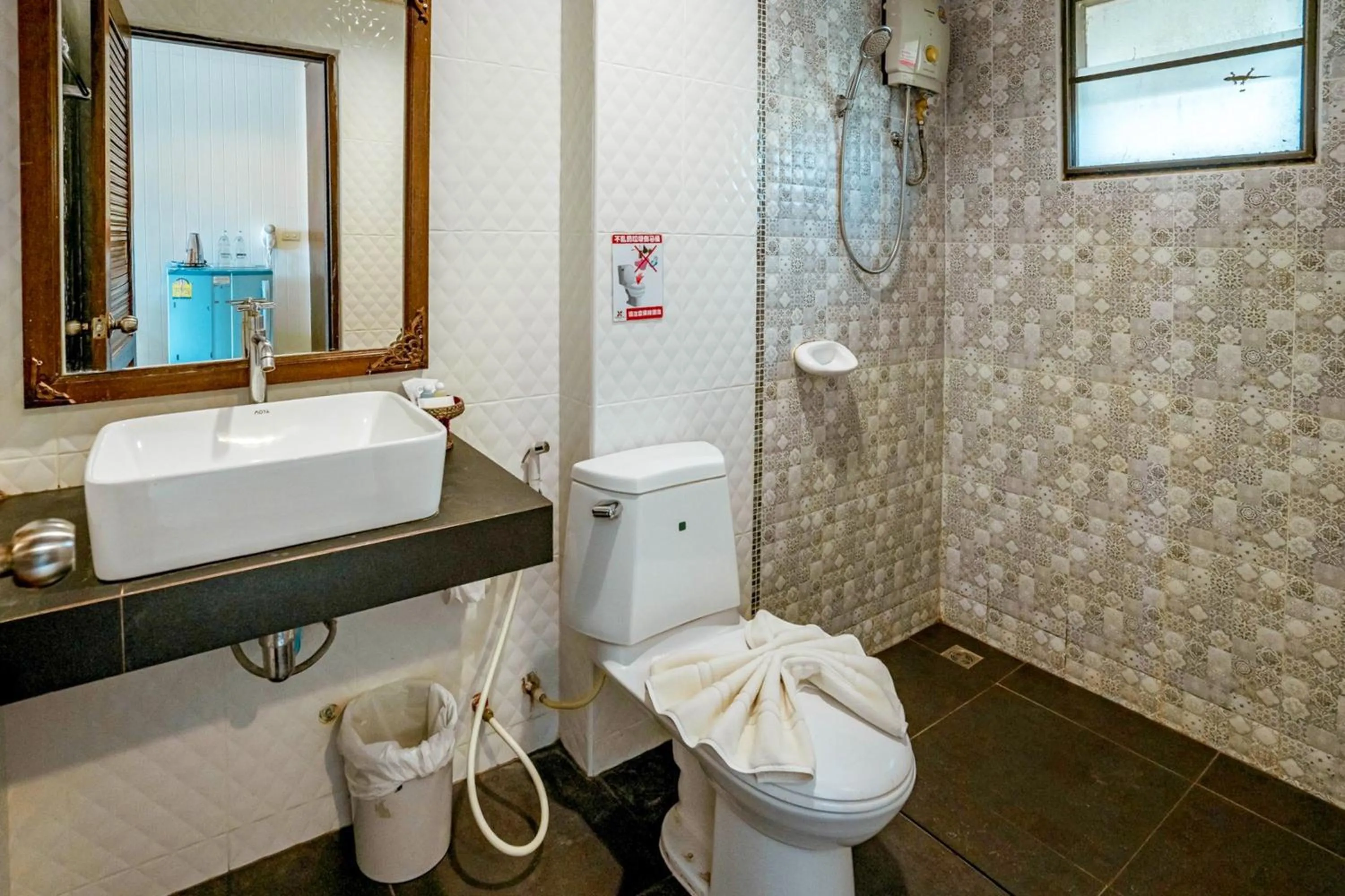 Shower in Kasalong Resort and Spa Pattaya