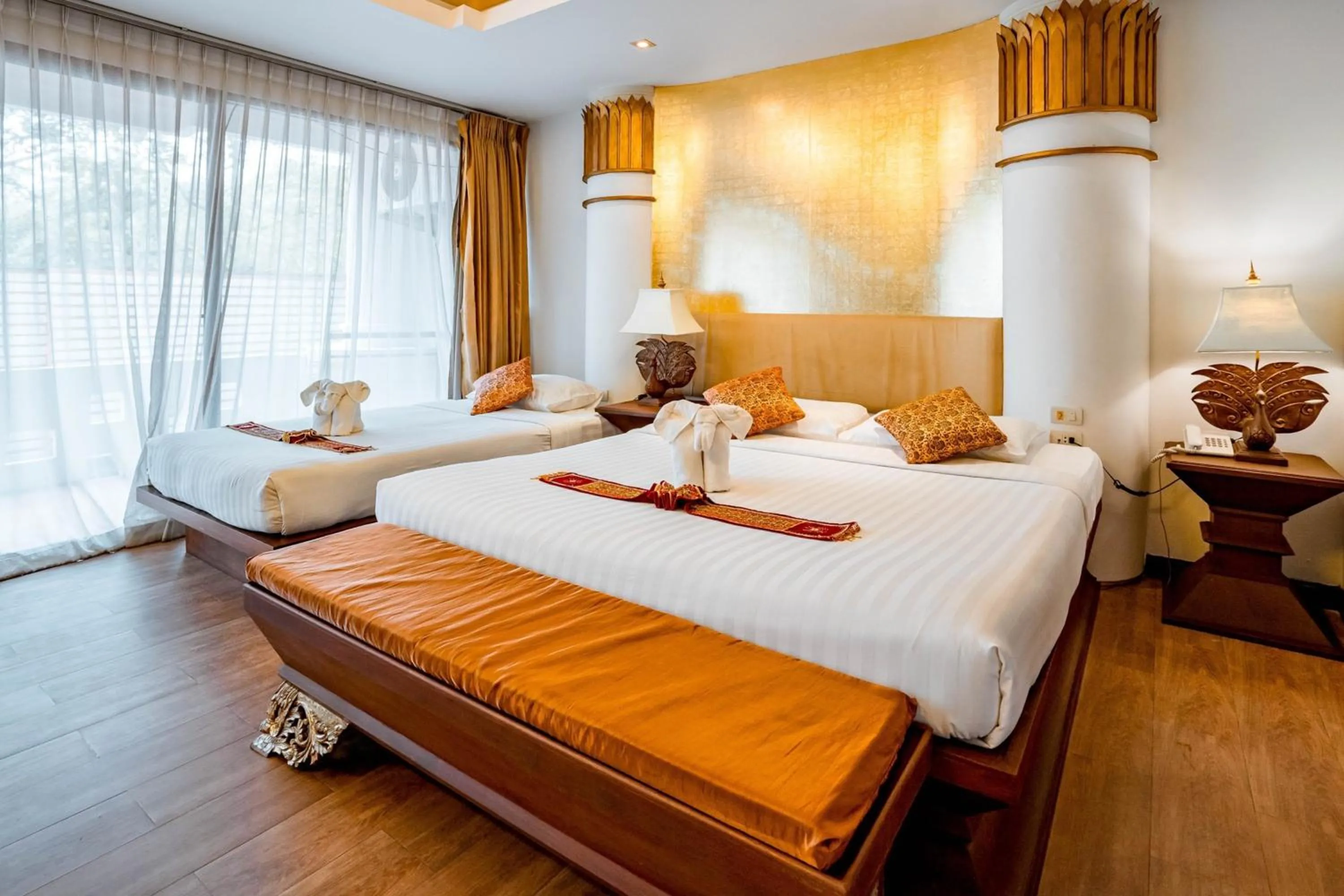 Bed in Kasalong Resort and Spa Pattaya