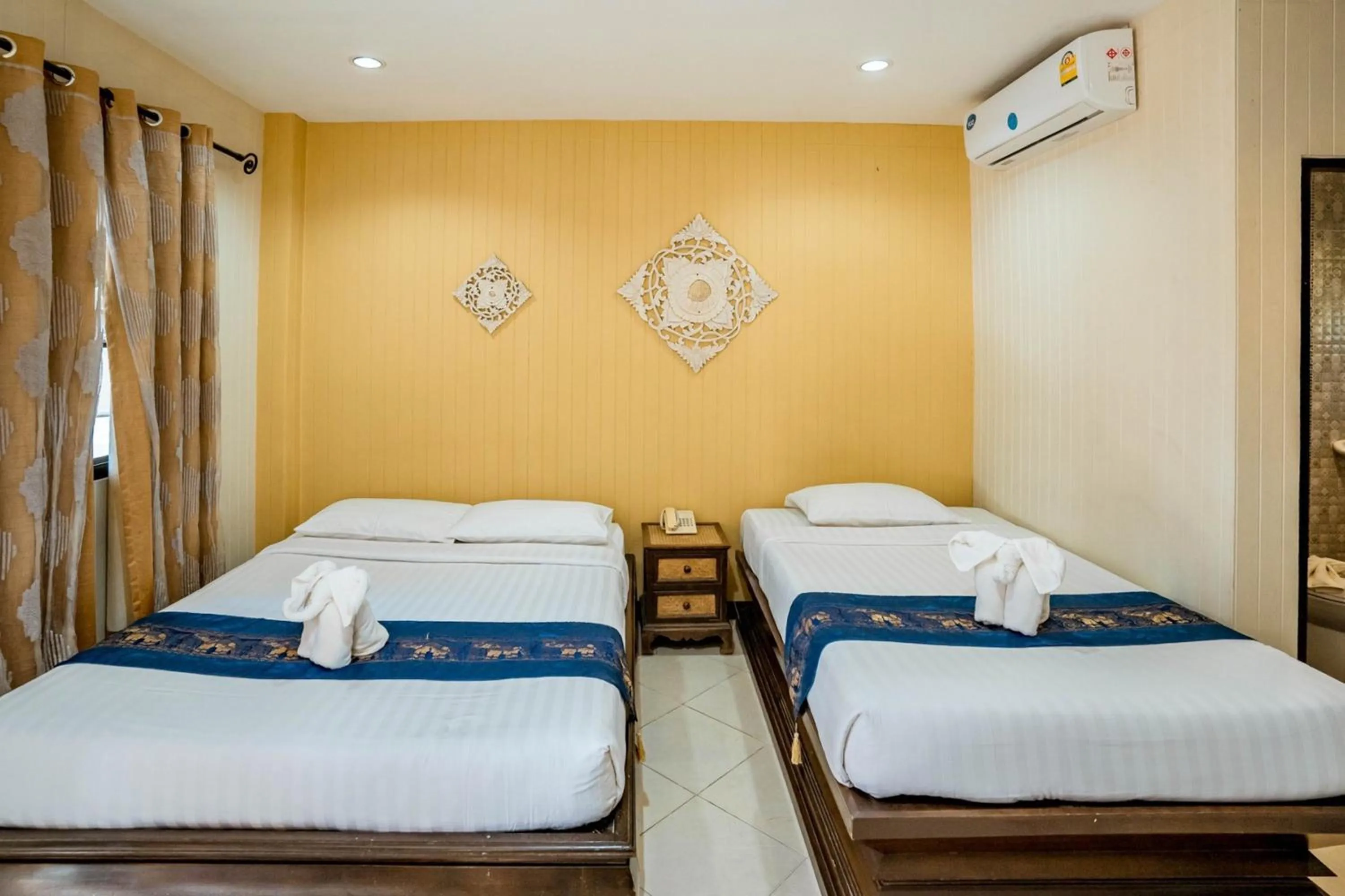 Bed in Kasalong Resort and Spa Pattaya