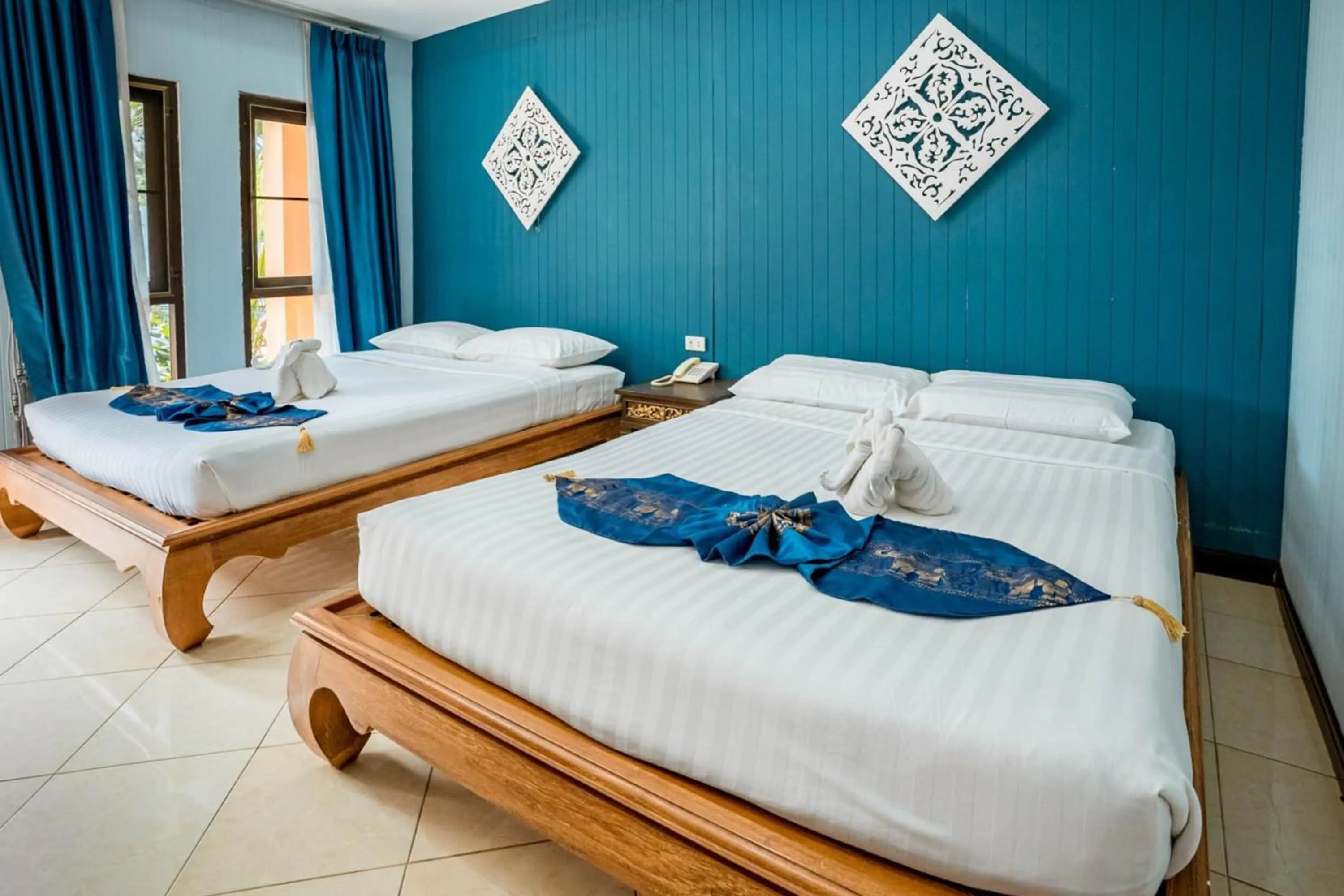 Bed in Kasalong Resort and Spa Pattaya