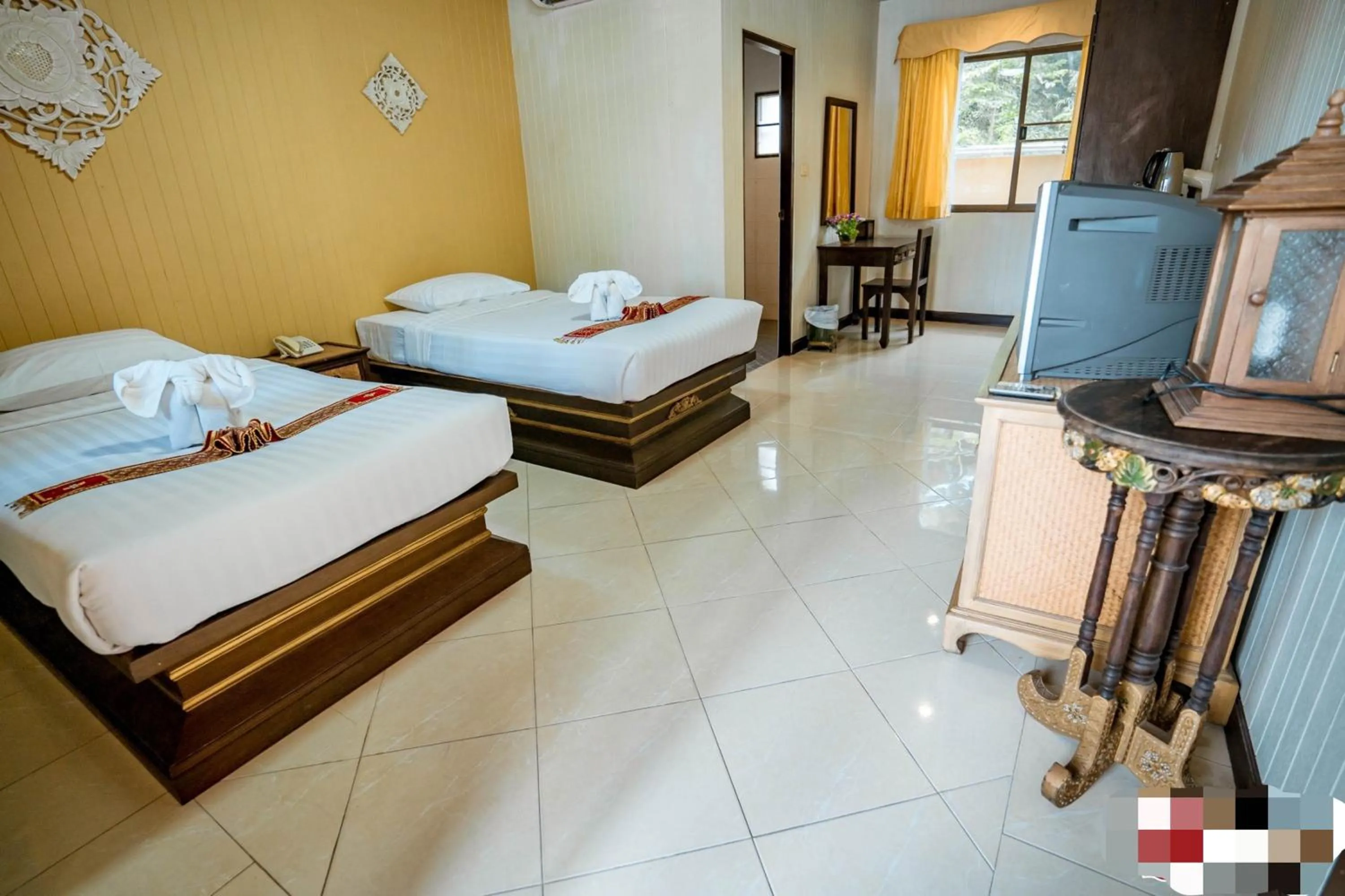 Bed in Kasalong Resort and Spa Pattaya