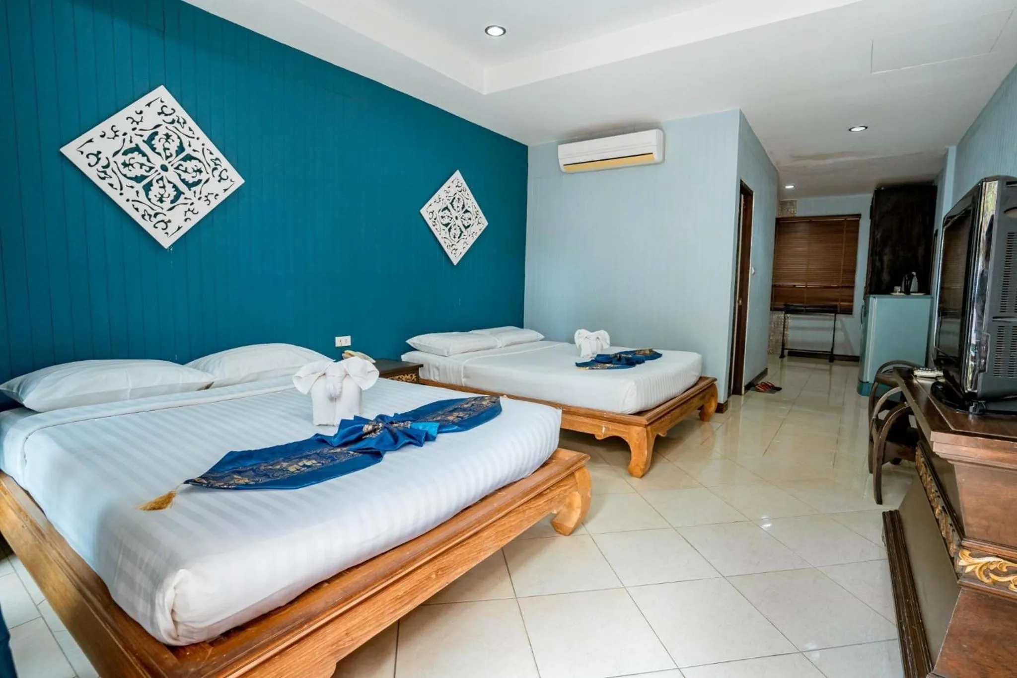 Bed in Kasalong Resort and Spa Pattaya