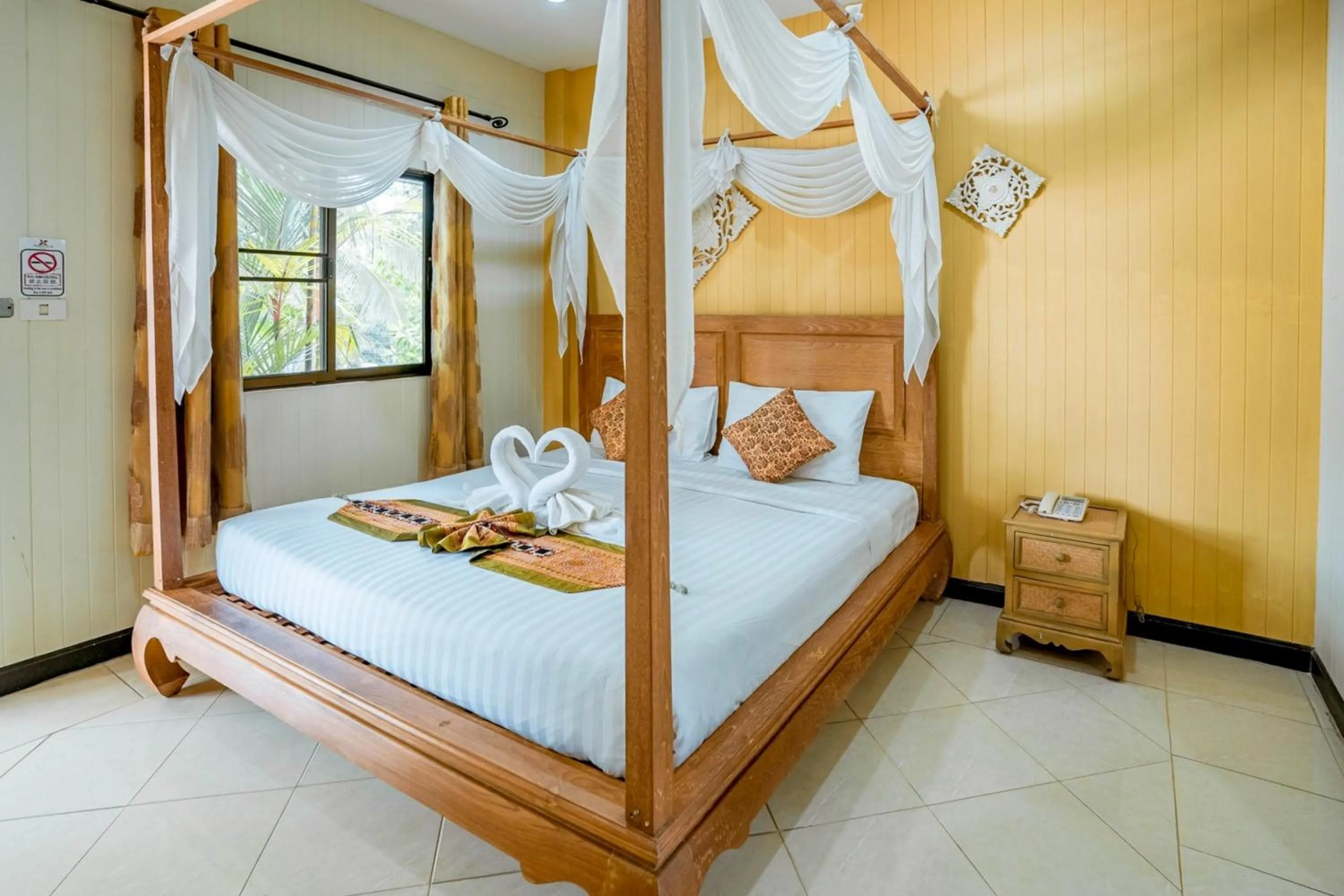 Bed in Kasalong Resort and Spa Pattaya