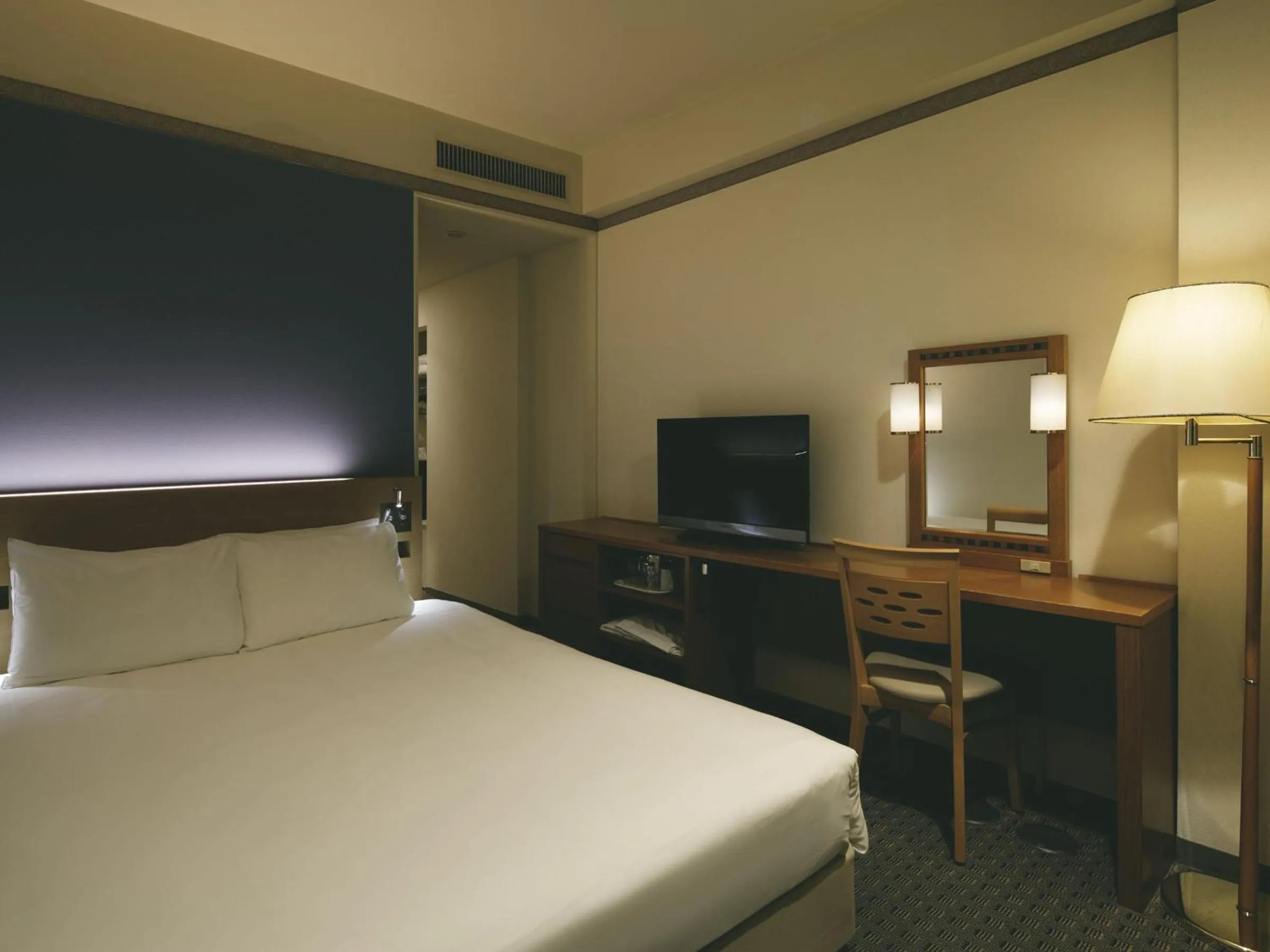 Bed in The Mark Grand Hotel