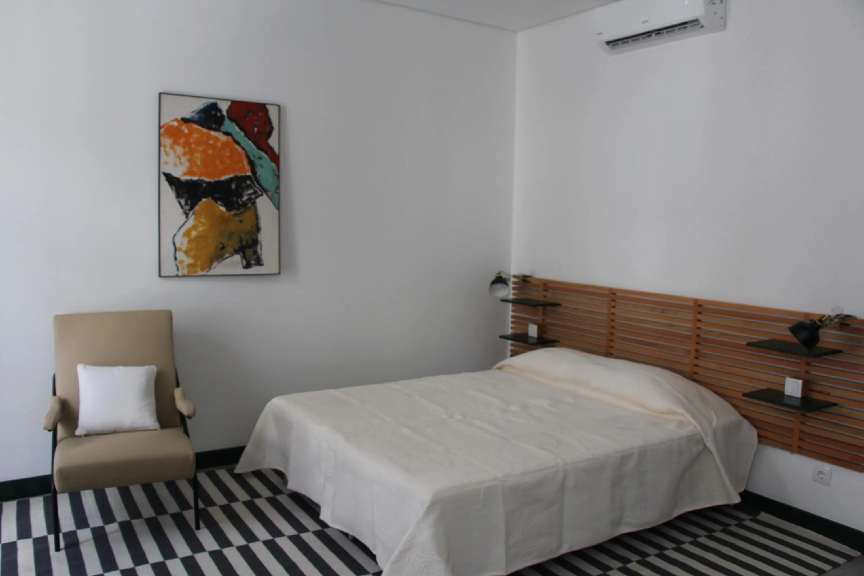 Bed in DoBairro suites at Bairro Alto