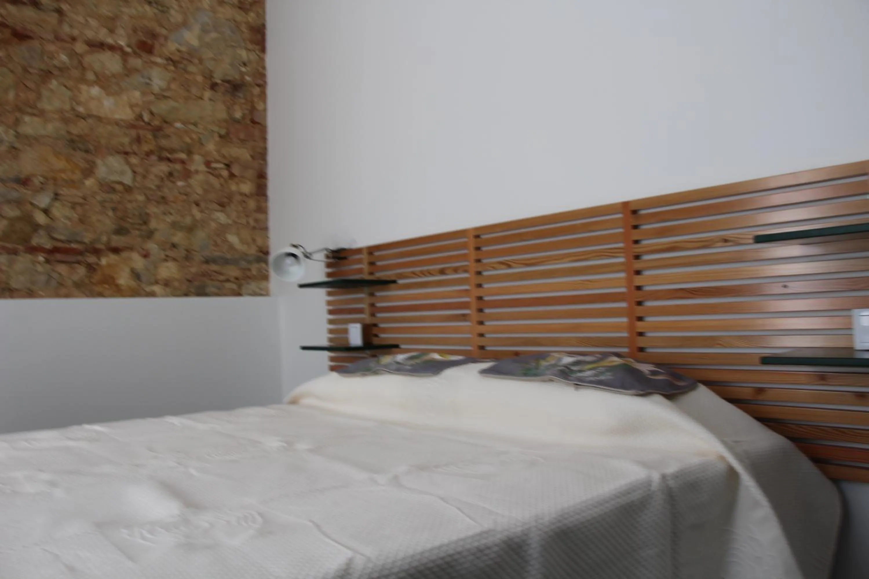 Bed in DoBairro suites at Bairro Alto