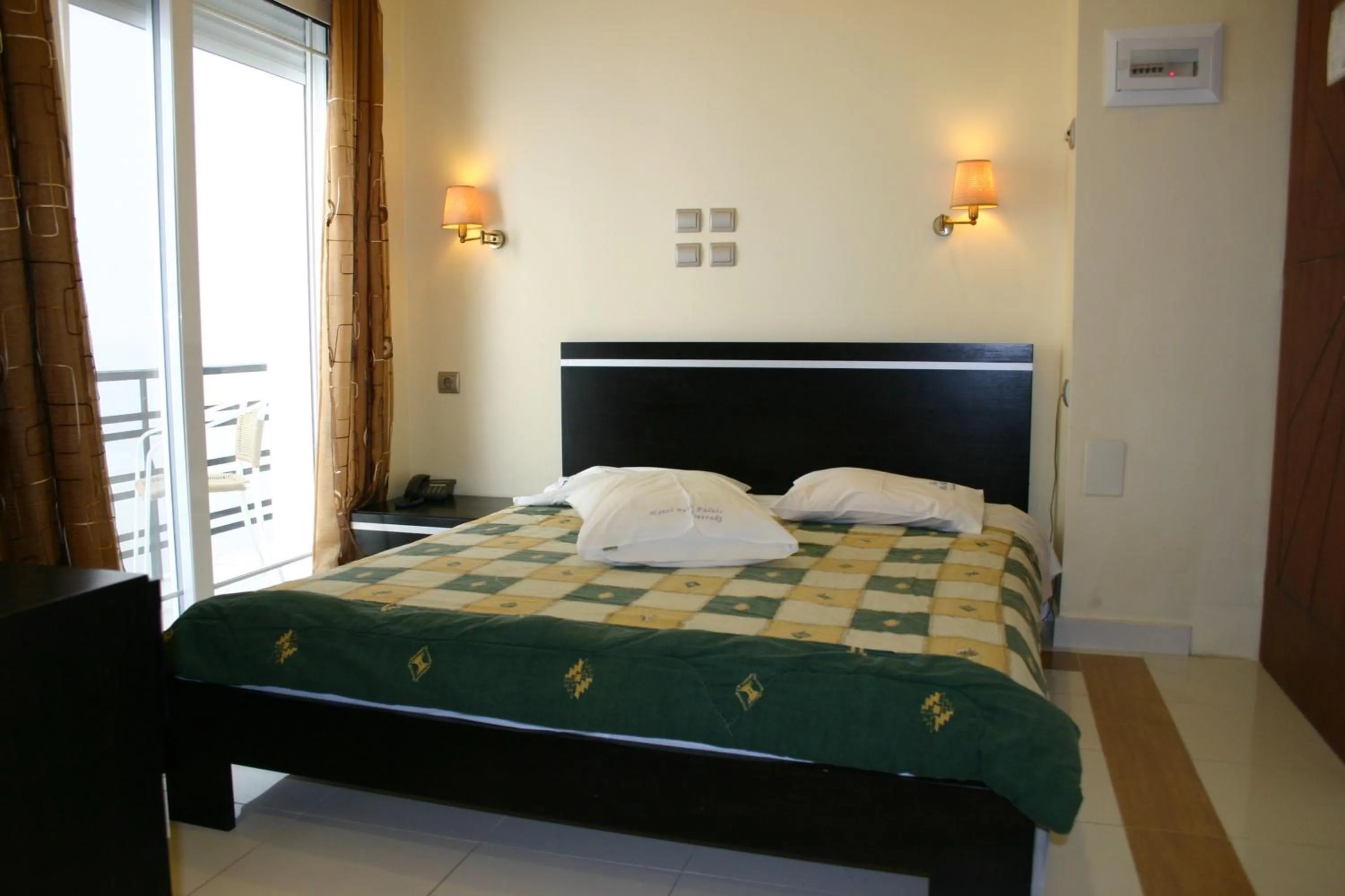 Bed in Petit Palais Hotel