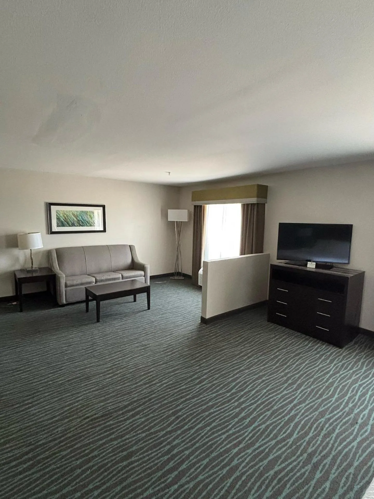 Living room in Ramada by Wyndham Burkburnett - Wichita Falls