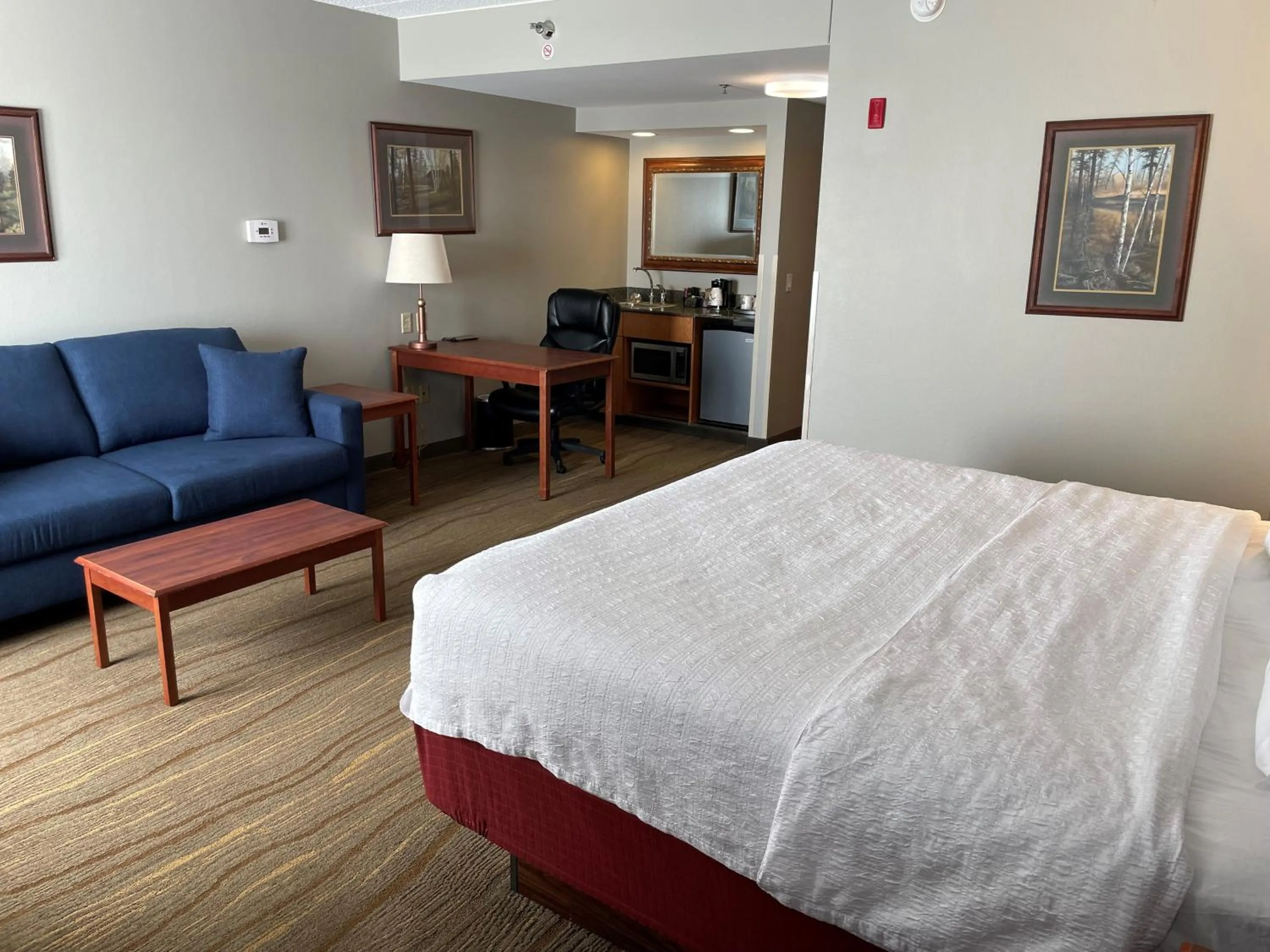 Seating area, Bed in SouthShore Hotel on Lake Bemidji, Trademark Coll by Wyndham