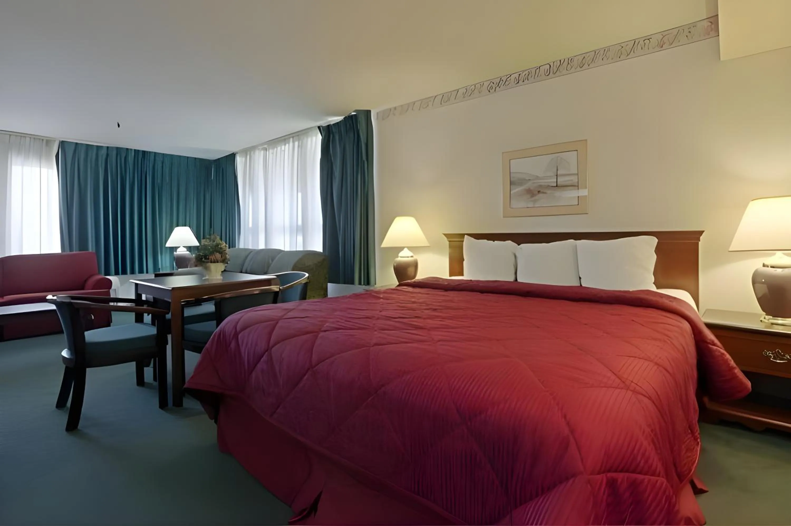 Seating area, Bed in Days Inn by Wyndham Gilroy