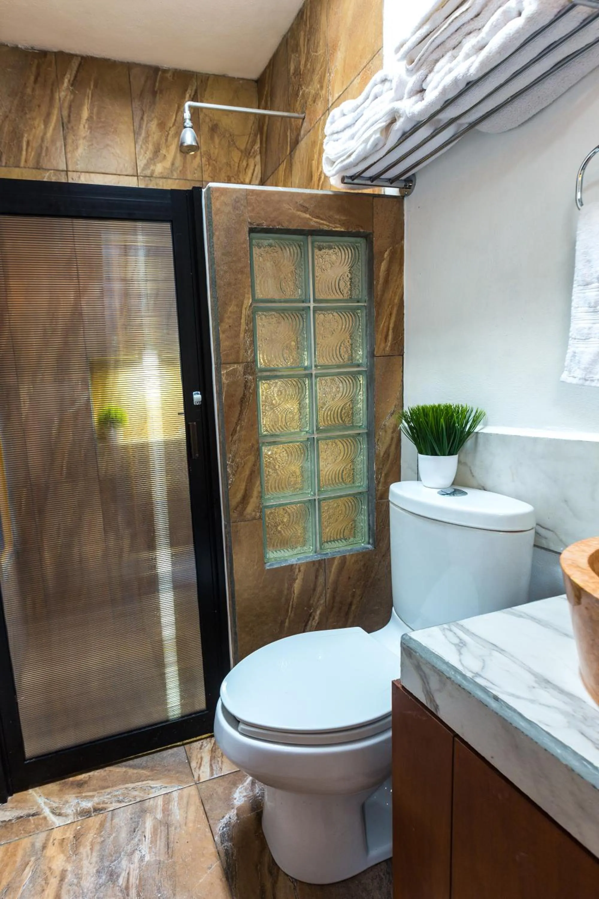 Toilet in Merida Serviced Apartments