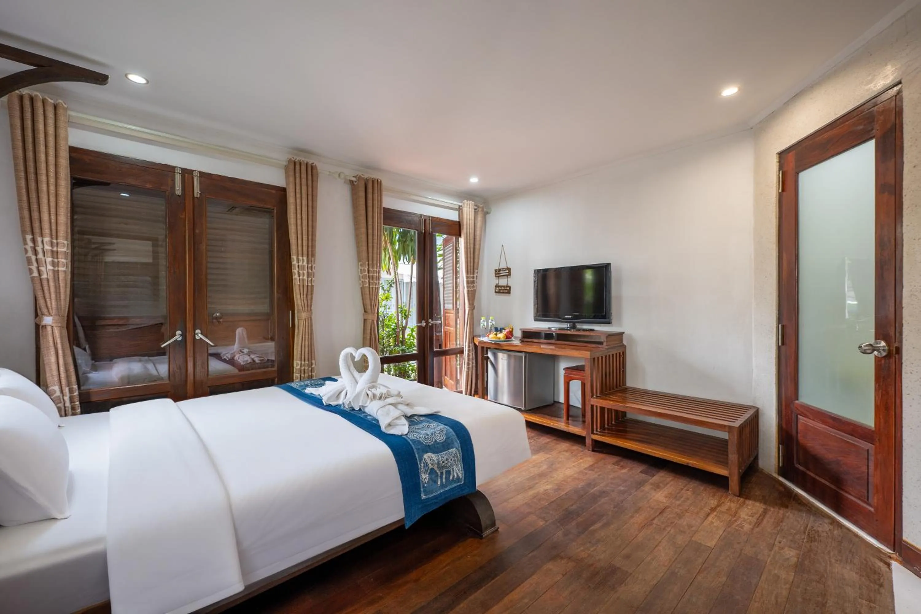 Bed in Ancient Luangprabang Hotel