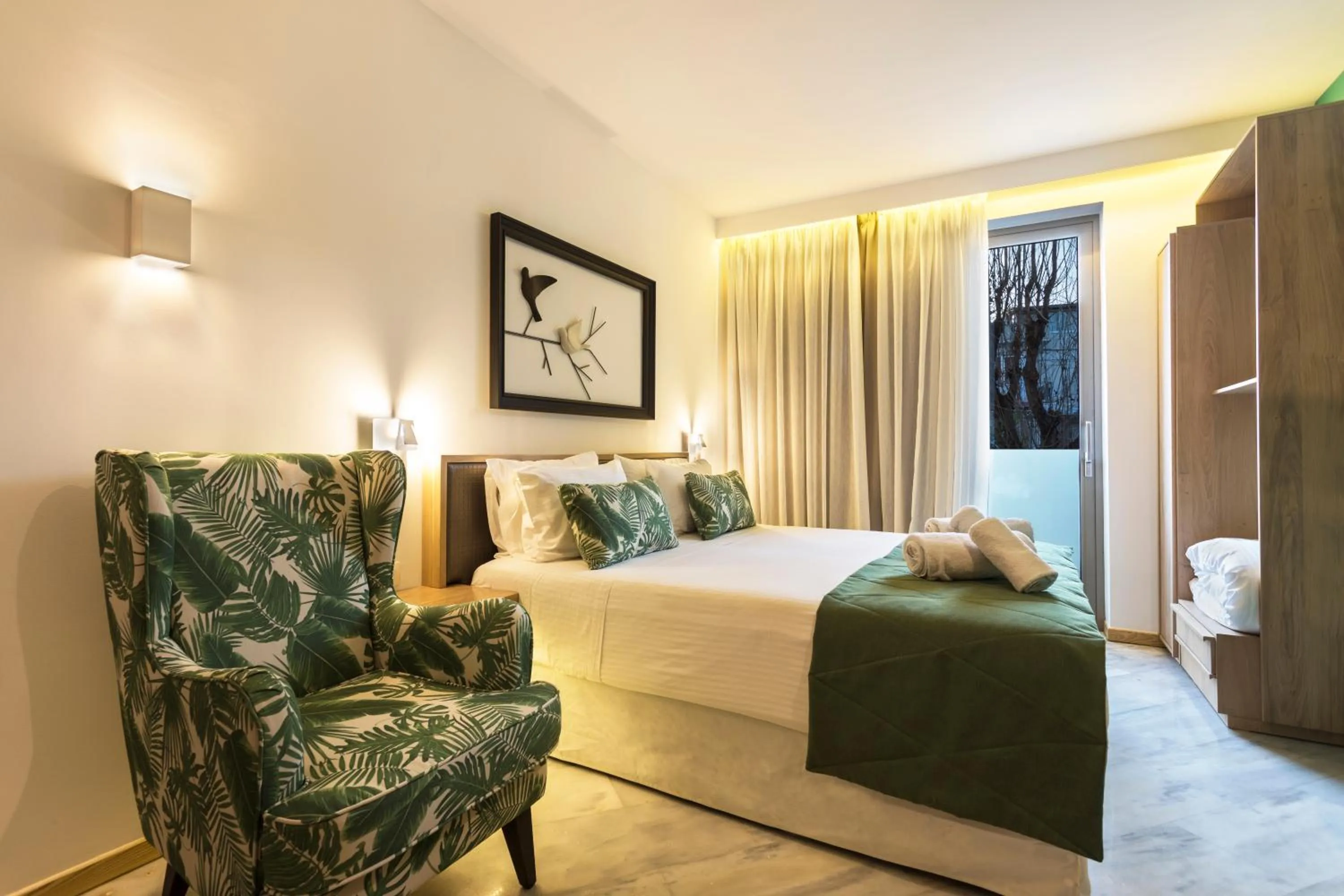 Seating area, Bed in Kalamaki Luxury Suites