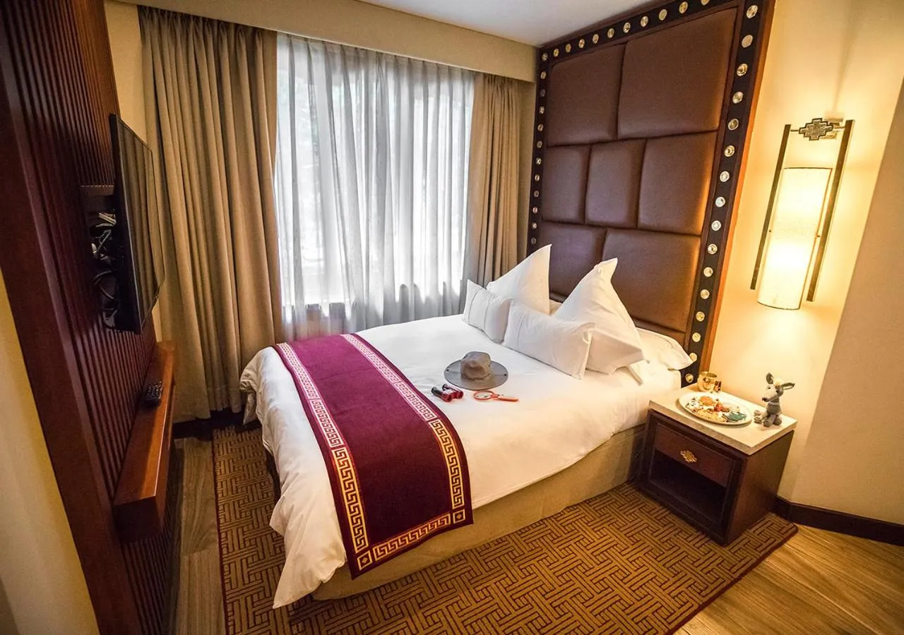 Bed in Sumaq Machu Picchu Hotel