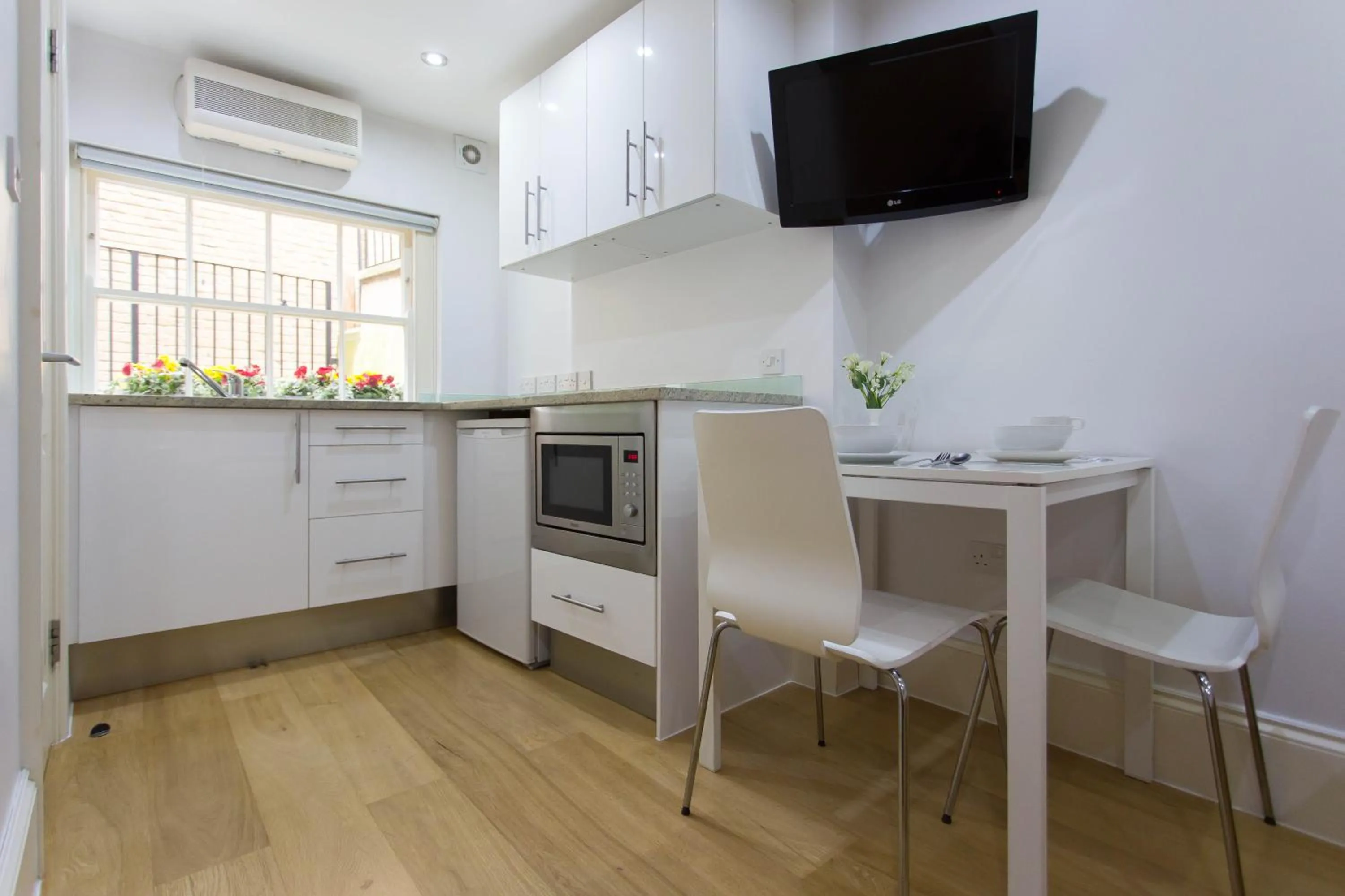 Kitchen or kitchenette in Paddington Green Serviced Apartments by Concept Apartments