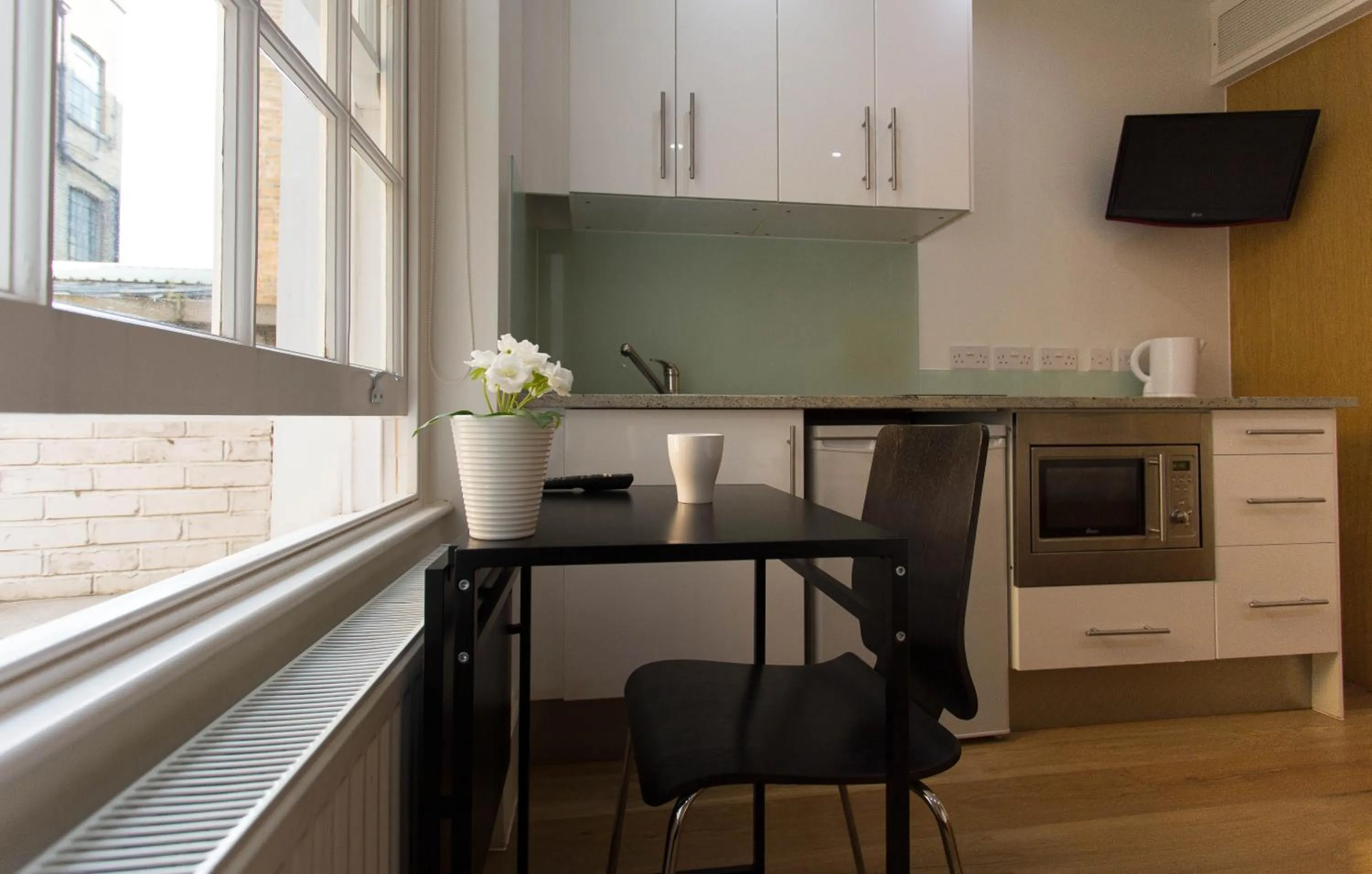 Kitchen or kitchenette in Paddington Green Serviced Apartments by Concept Apartments