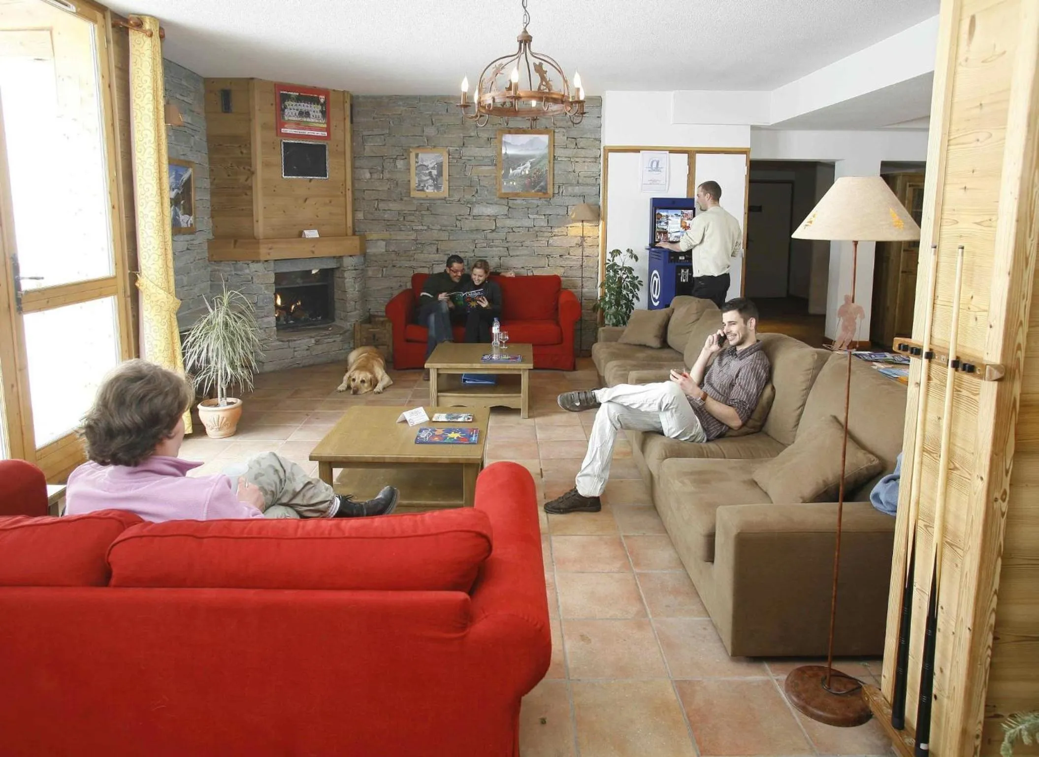 Communal lounge/ TV room in Résidence Odalys Le Hameau et les Chalets de la Vallée d'Or