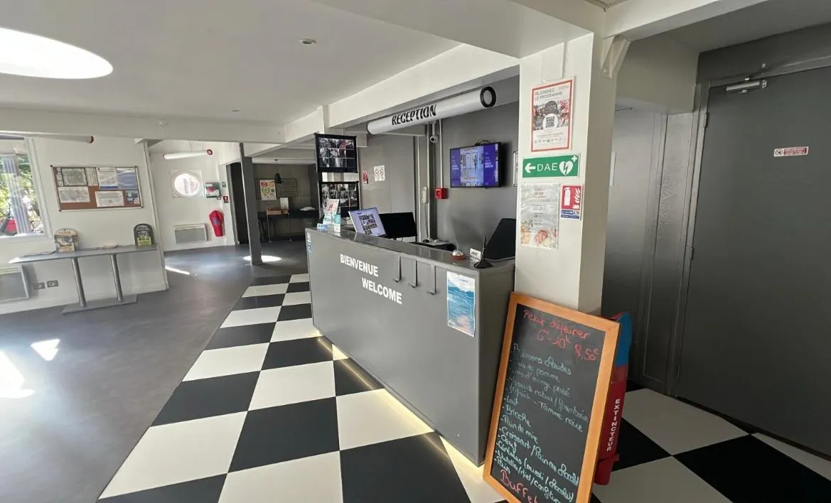 Seating area in Enzo Hotels Trappes by Kyriad Direct