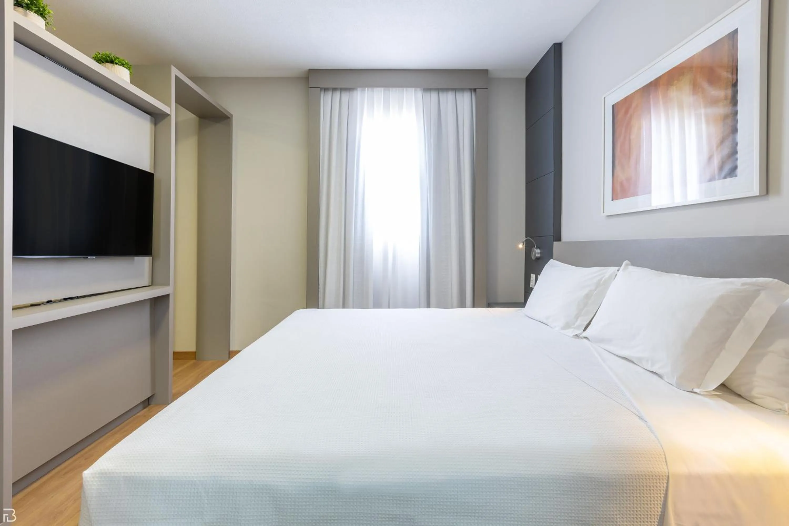 Bed in Nobile Suítes Uberlândia