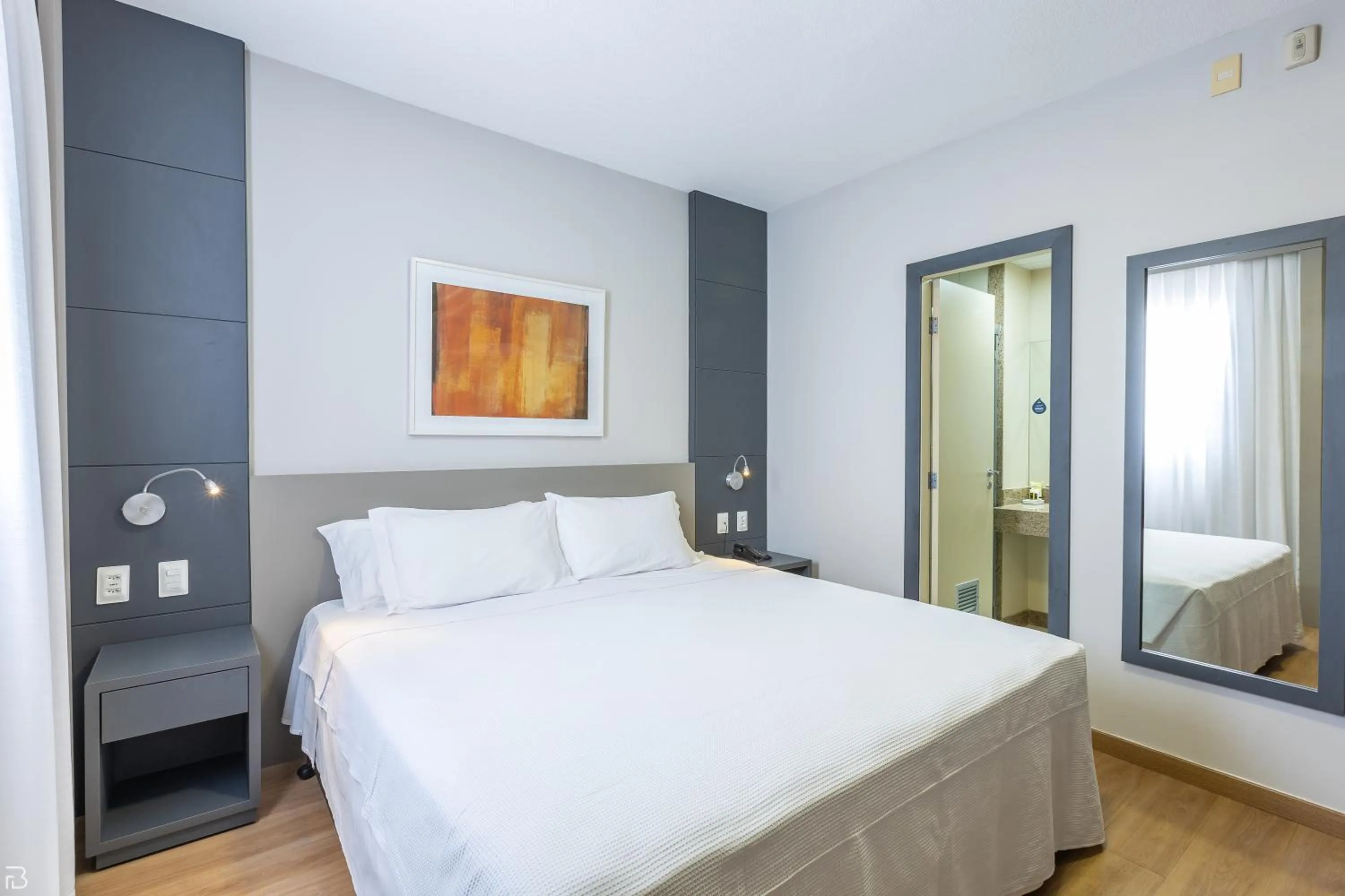 Bed in Nobile Suítes Uberlândia