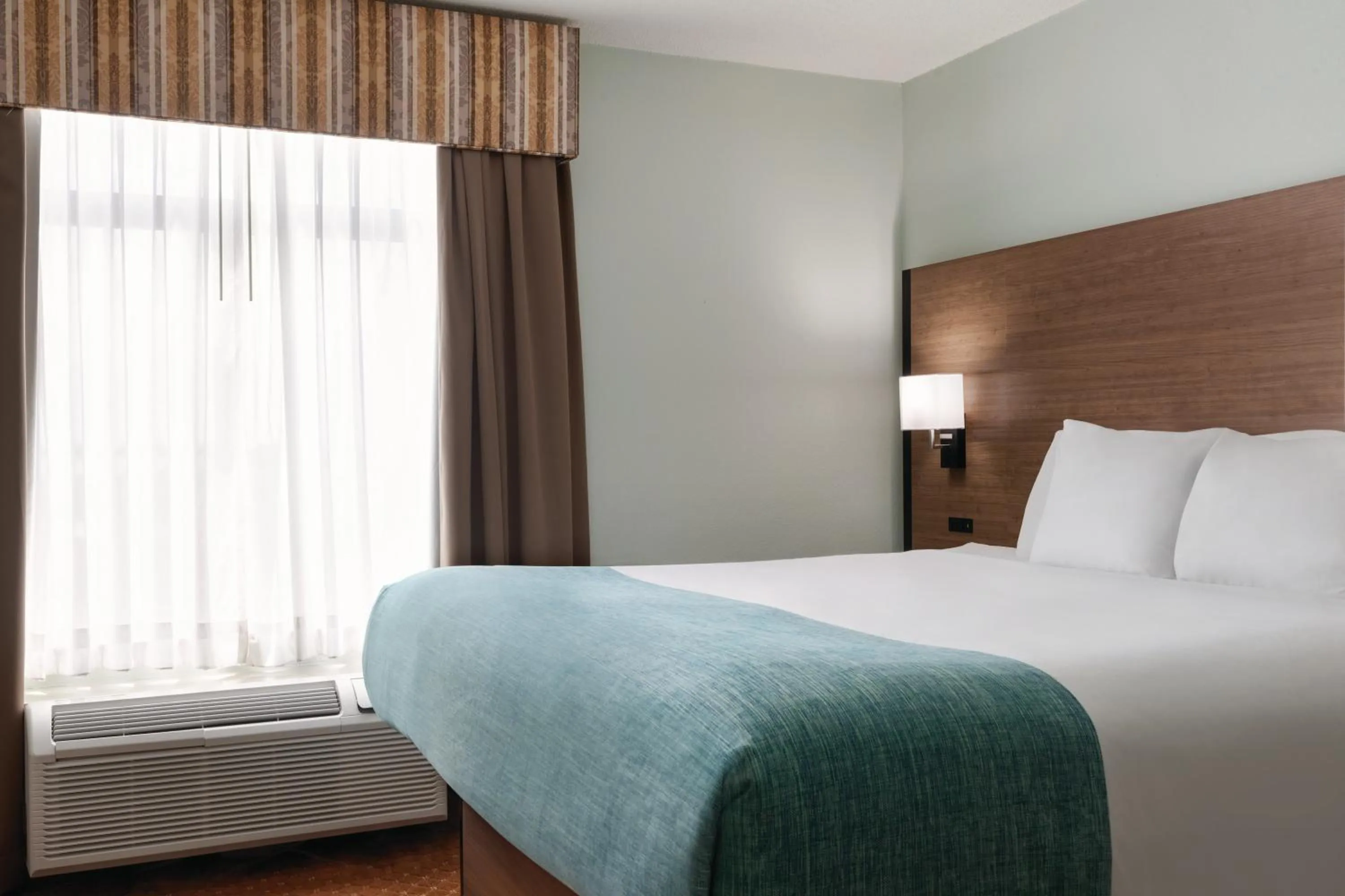 Bed in Wingate by Wyndham Louisville East