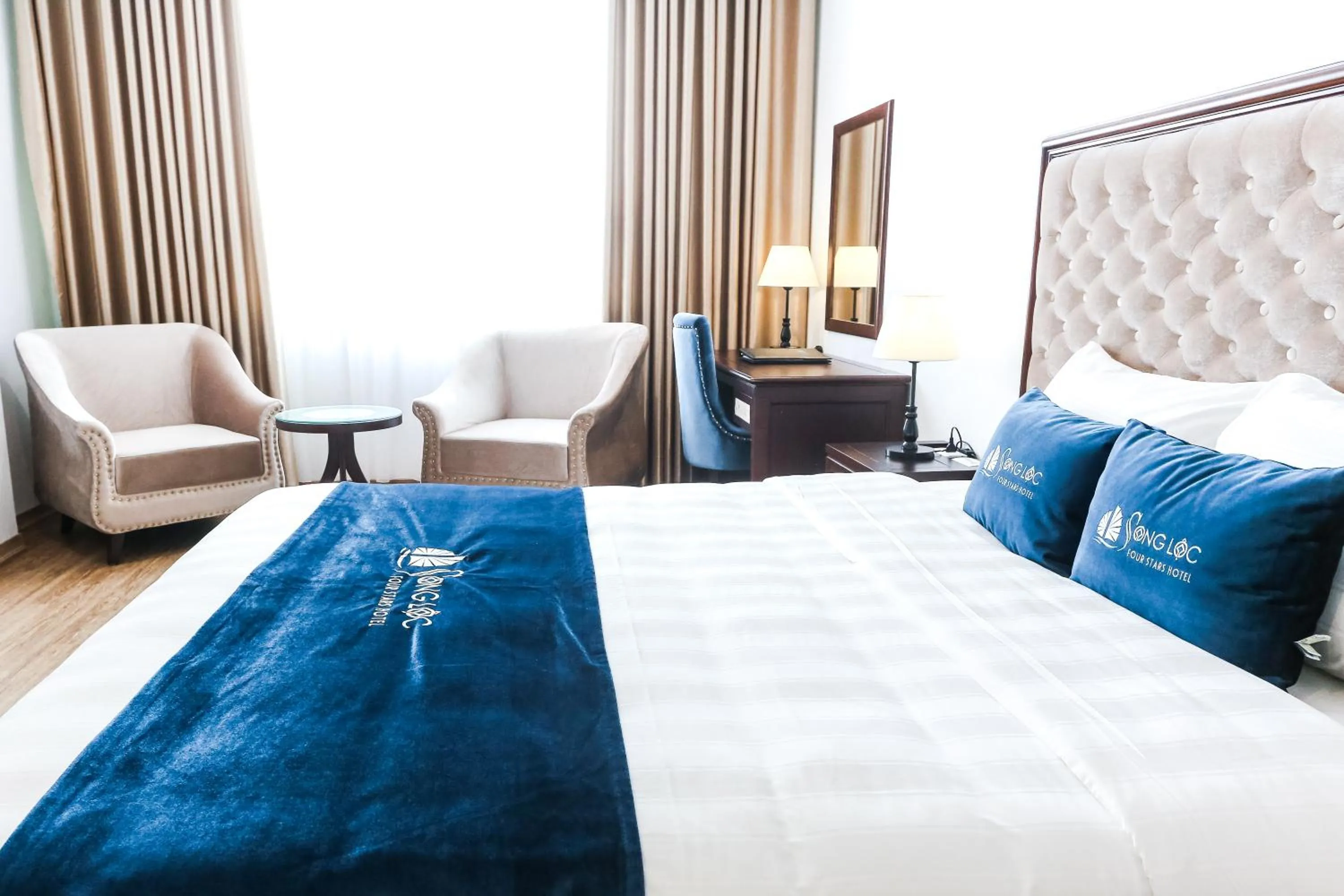 Bed in Song Loc Luxury Hotel