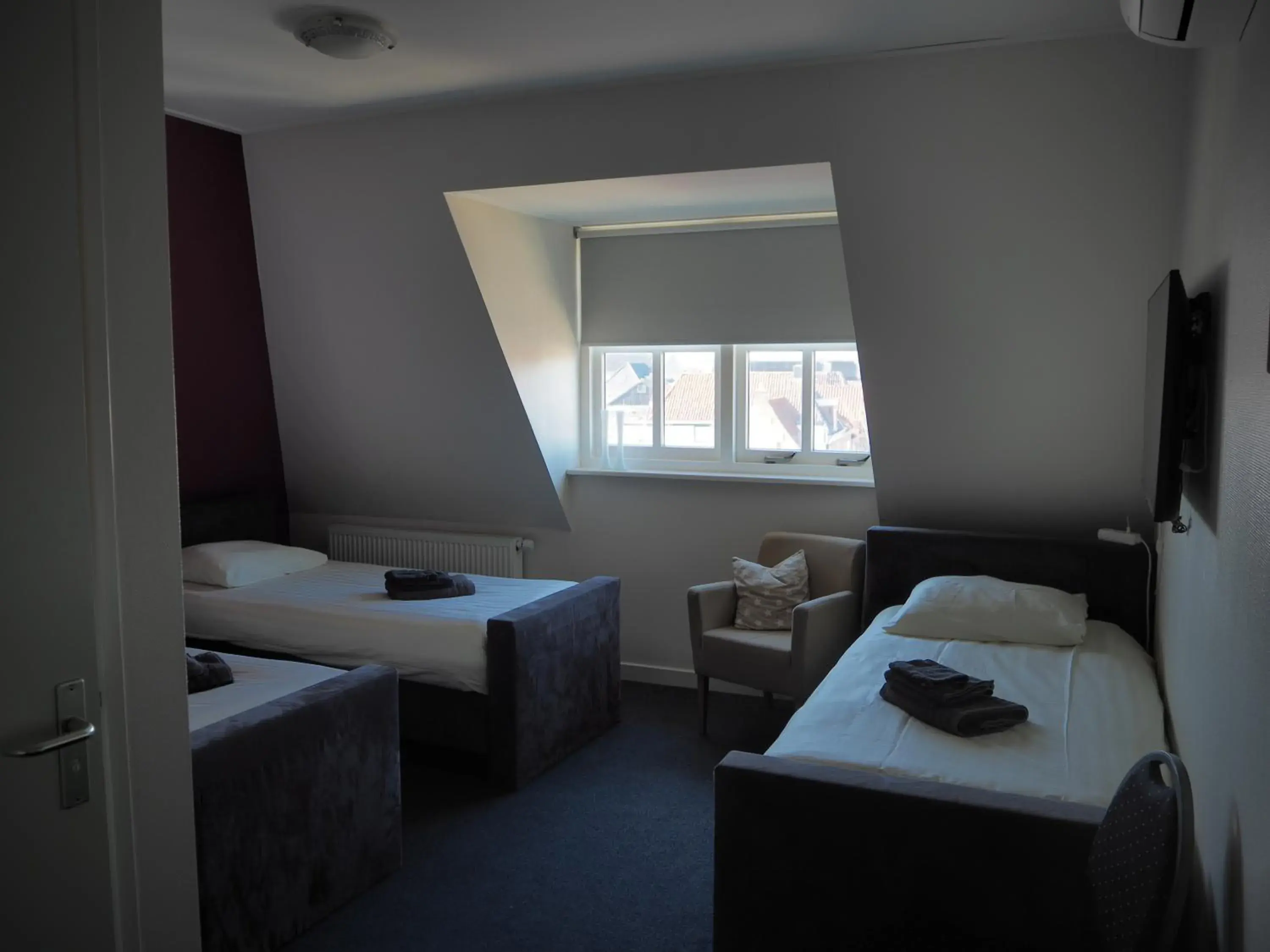 Deluxe Triple Room in Hotel de Harmonie Deluxe Triple Room in Hotel de Harmonie