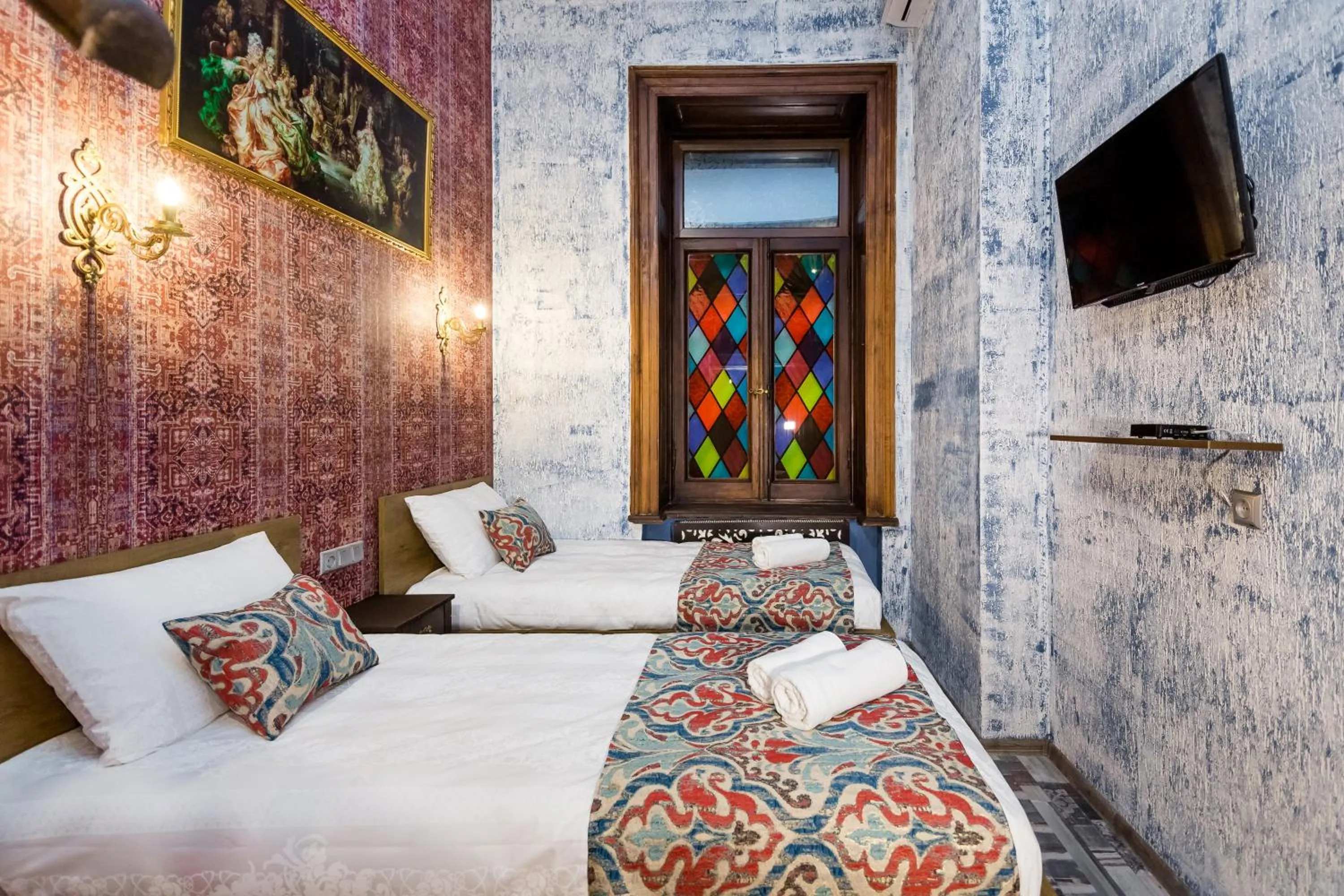 Bed in Tiflis Inn Boutique Hotel