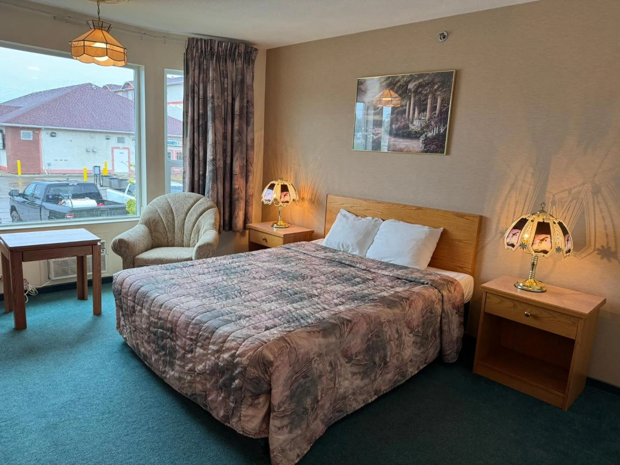 Bed in Western Budget Motel #3 Whitecourt