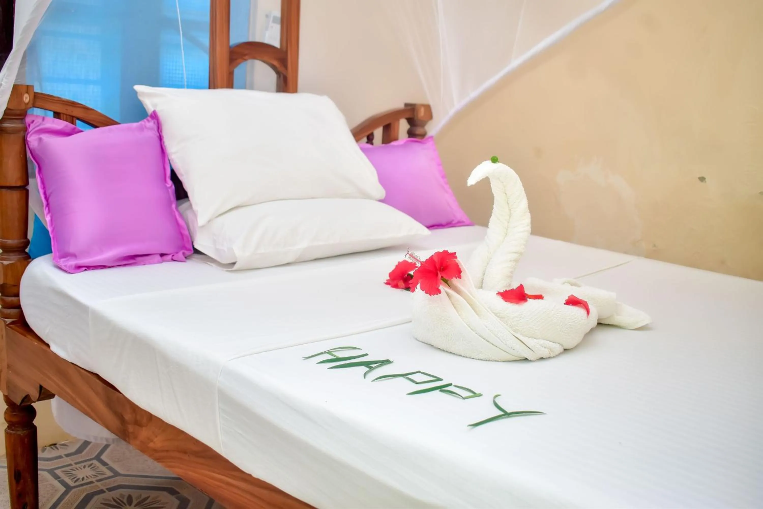 Bed in Blue Earth Beach Bungalow