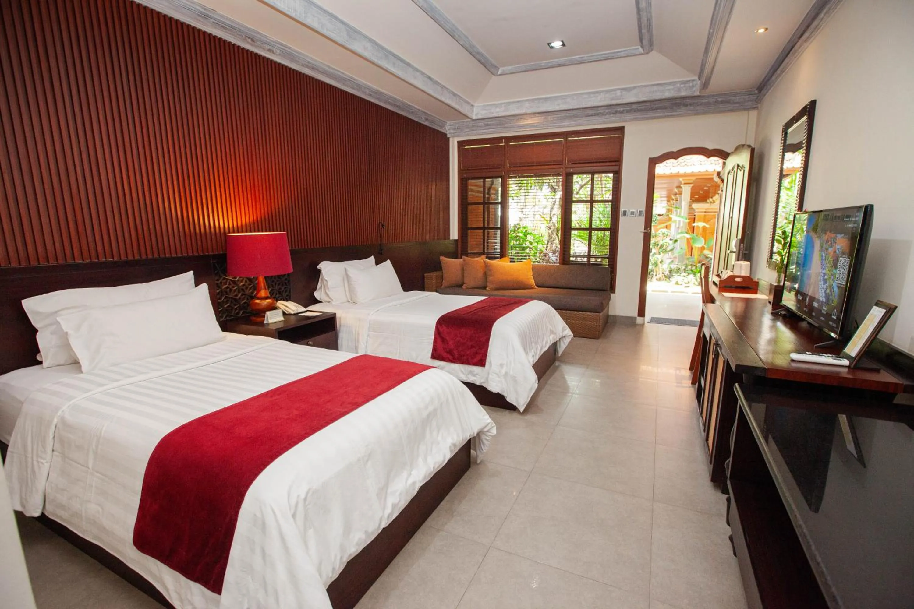Communal lounge/ TV room, Bed in Griya Santrian a Beach Resort And Spa