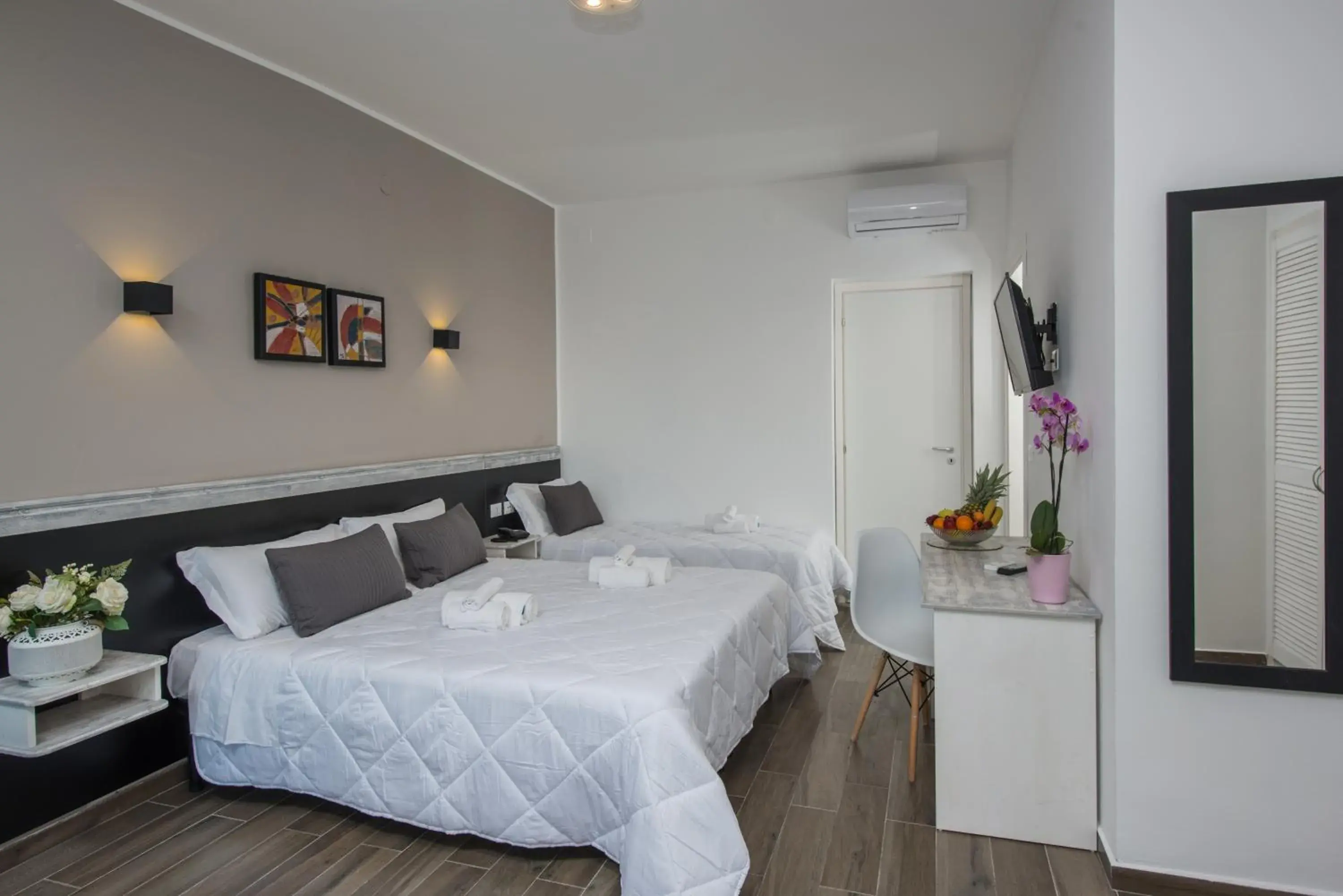 Standard Triple Room - single occupancy in Hotel Baia D'oro Standard Triple Room - single occupancy in Hotel Baia D'oro