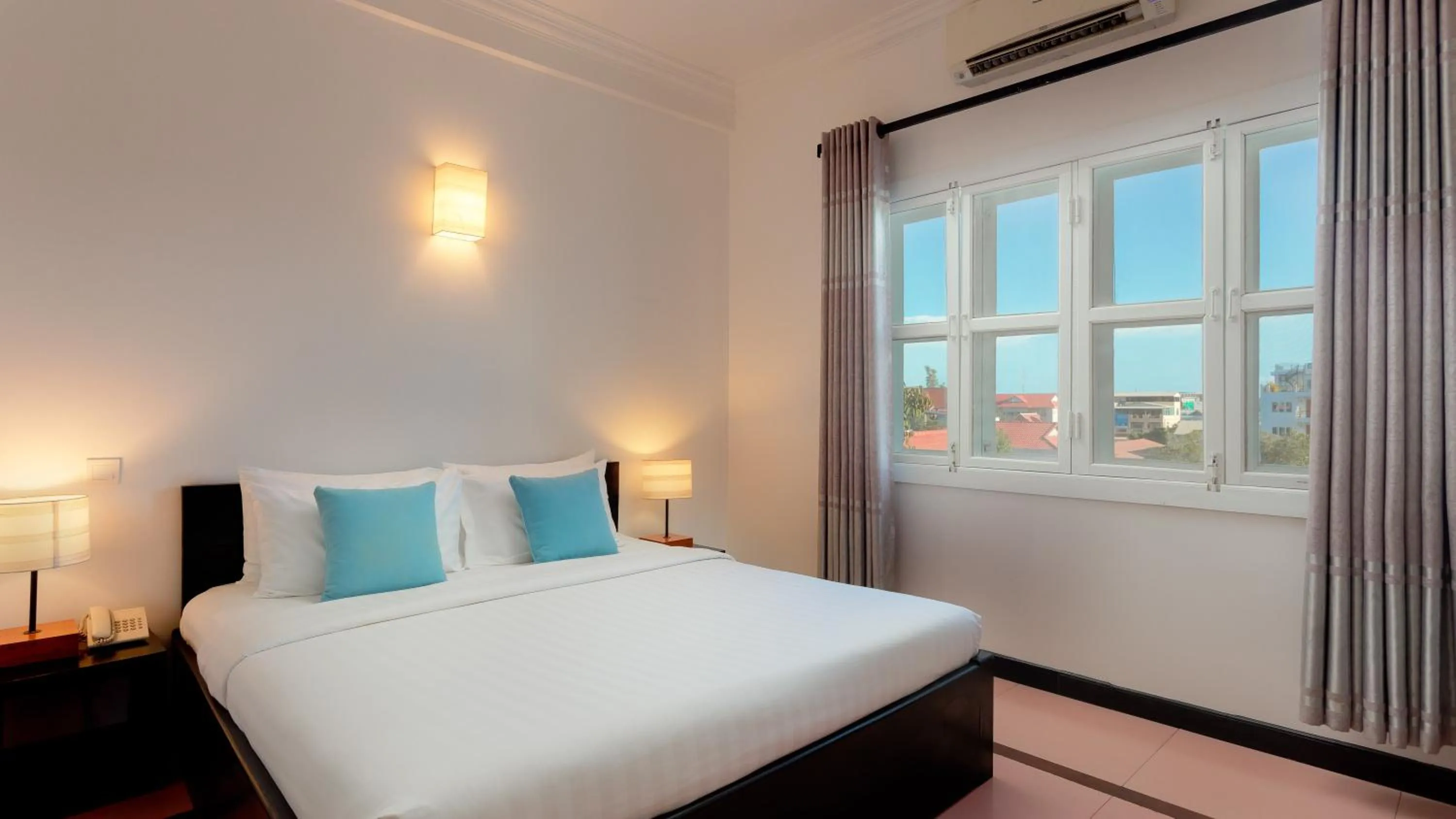 Bed in Amber Angkor Villa Hotel & Spa