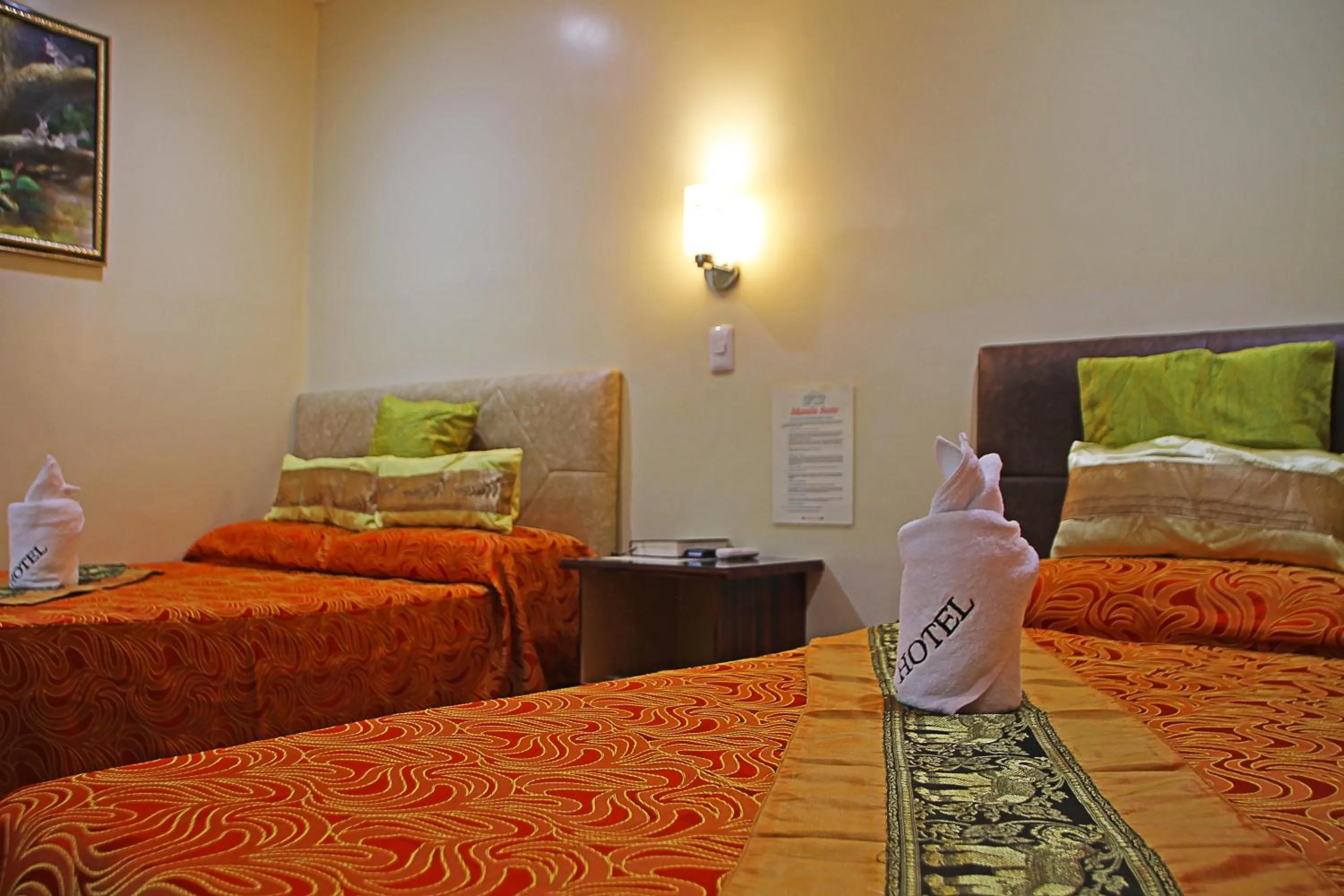 Bed in Fj Manila Hotel